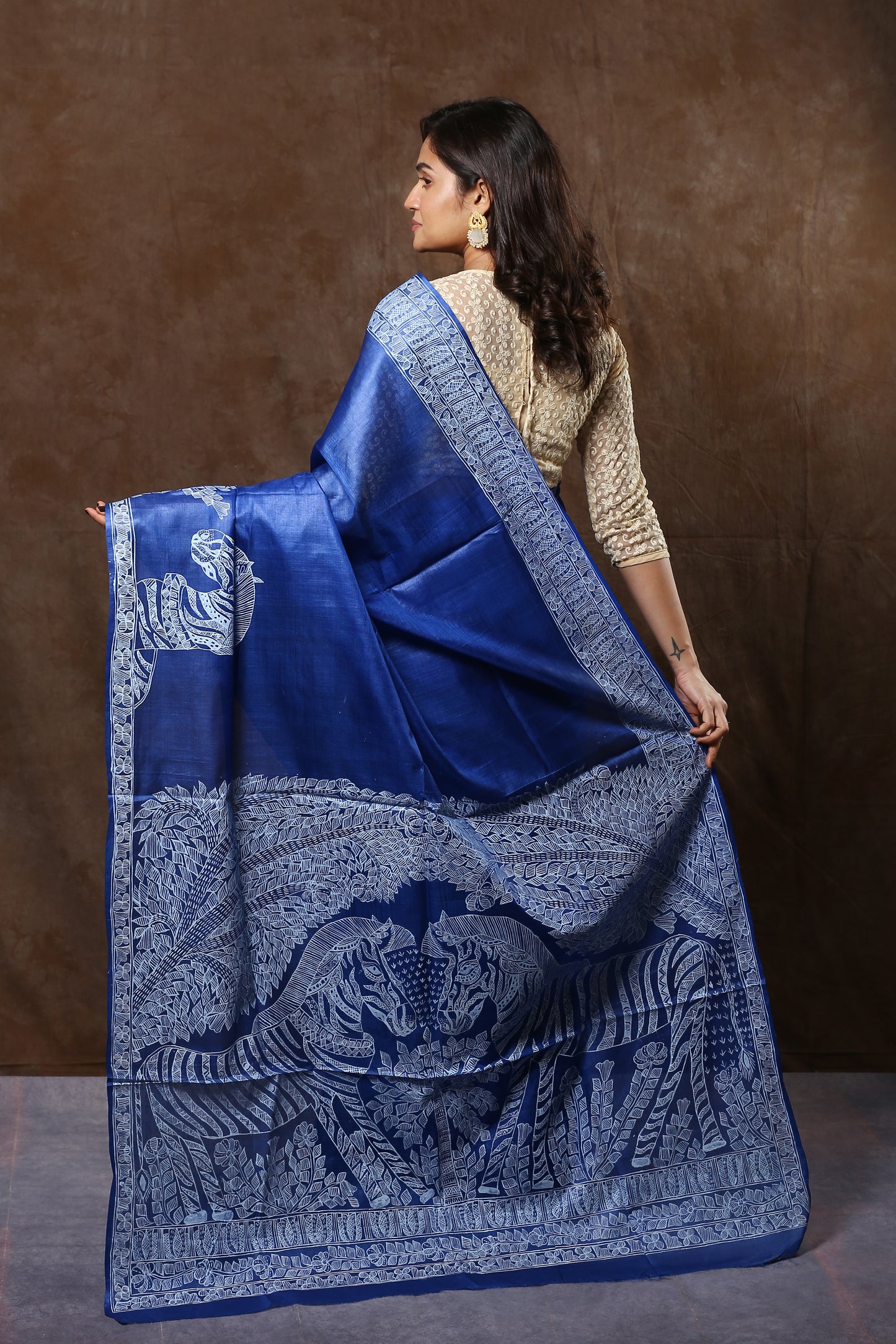 Blue Tussar silk saree with white Madhubani Zebra art, perfect for festive occasions. | Urbane Essence