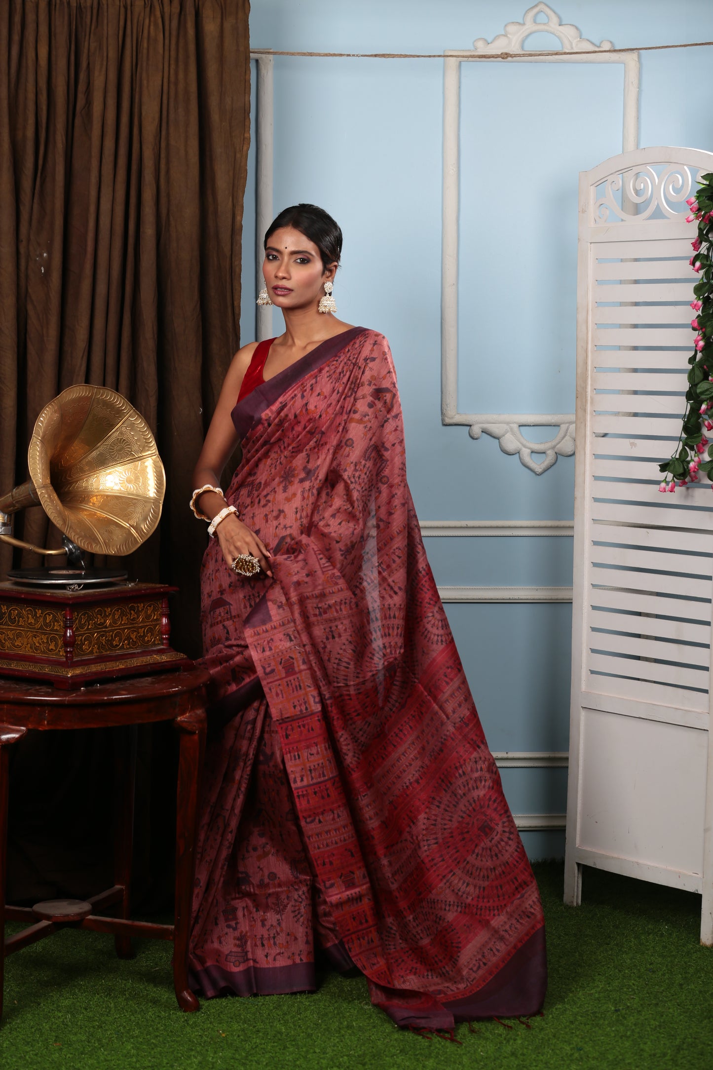 Rust-colored cotton saree with all-over Warli tribal art, perfect for festive occasions. | Urbane Essence