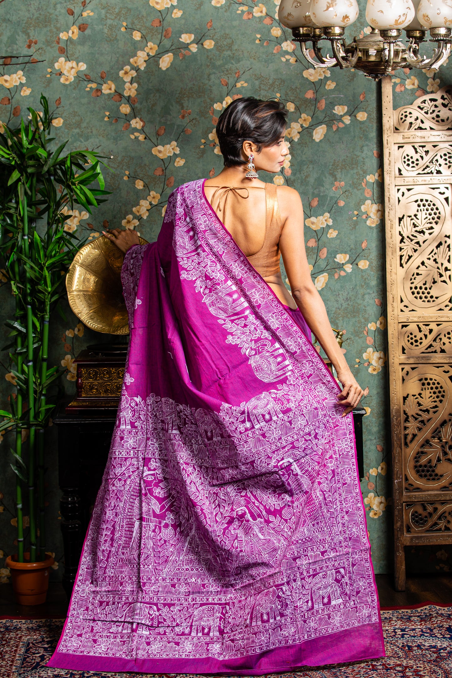 Woman in a magenta Tussar silk saree with white Madhubani painting, perfect for cultural events | Urbane Essence