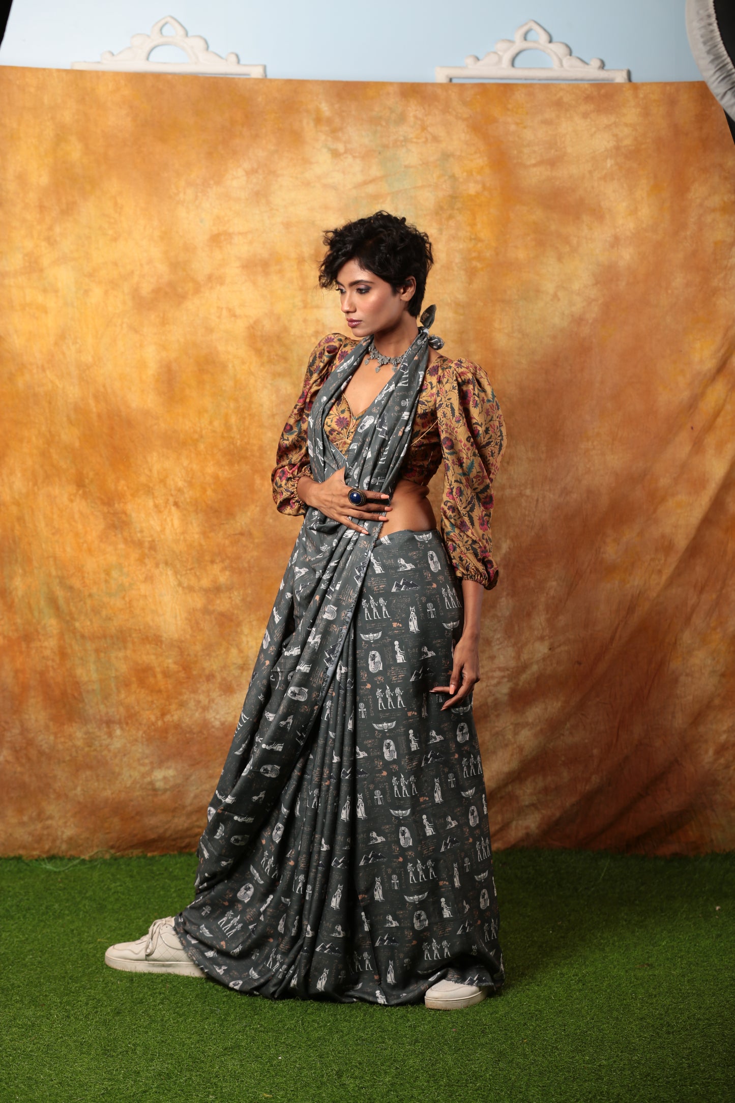 Grey Egyptian print saree with white hieroglyphs, paired with a patterned blouse, suitable for unique occasions | Urbane Essence