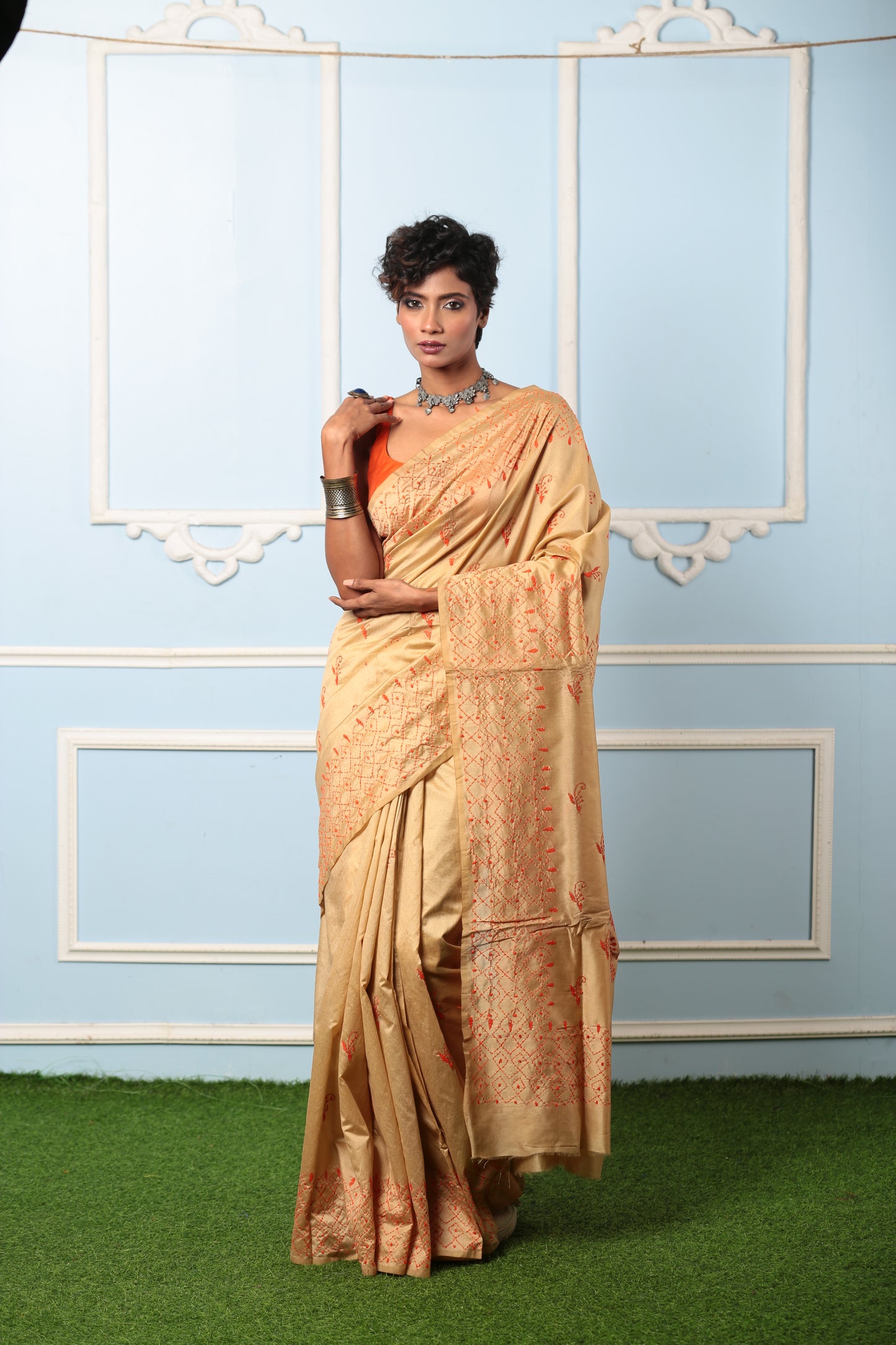 Beige Kantha stitch silk saree with orange embroidery, ideal for traditional events. | Urbane Essence