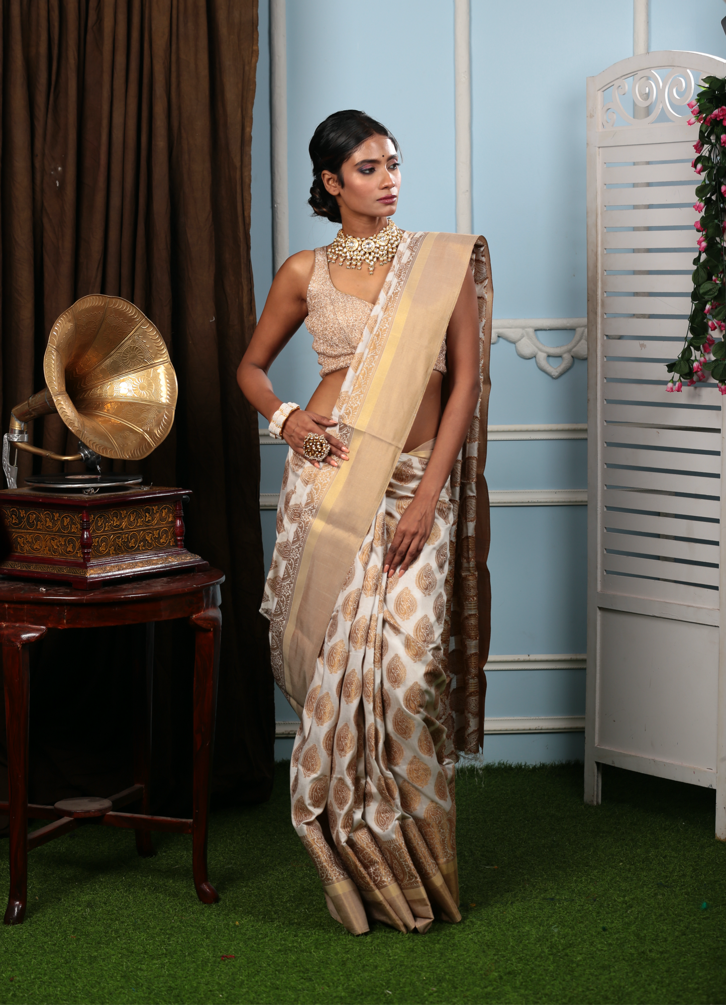 Elegant white and gold South silk saree with traditional patterns, perfect for professional events or Pujas. | Urbane Essence