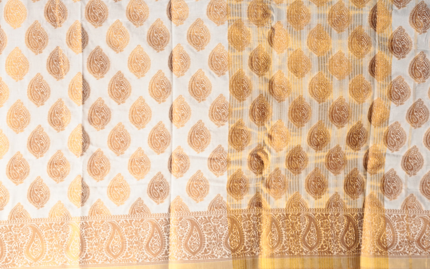 White and gold South silk saree with traditional paisley patterns, ideal for professional events or Pujas | Urbane Essence