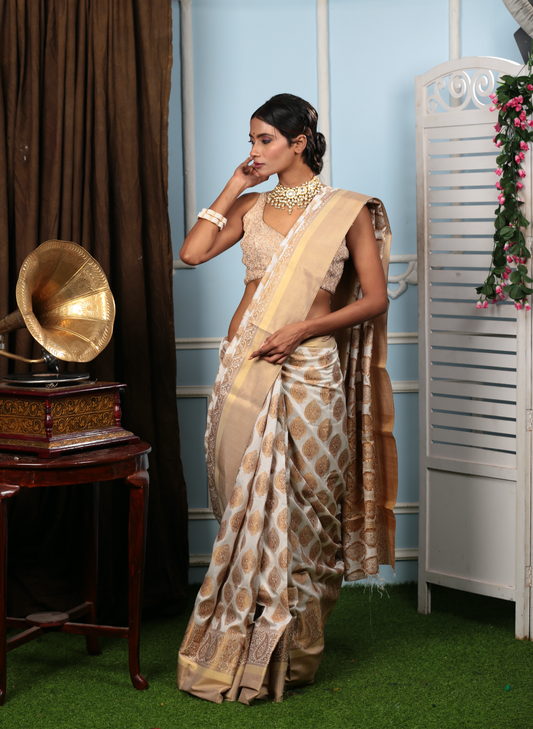White and gold South silk saree with traditional patterns, ideal for professional events or Pujas | Urbane Essence