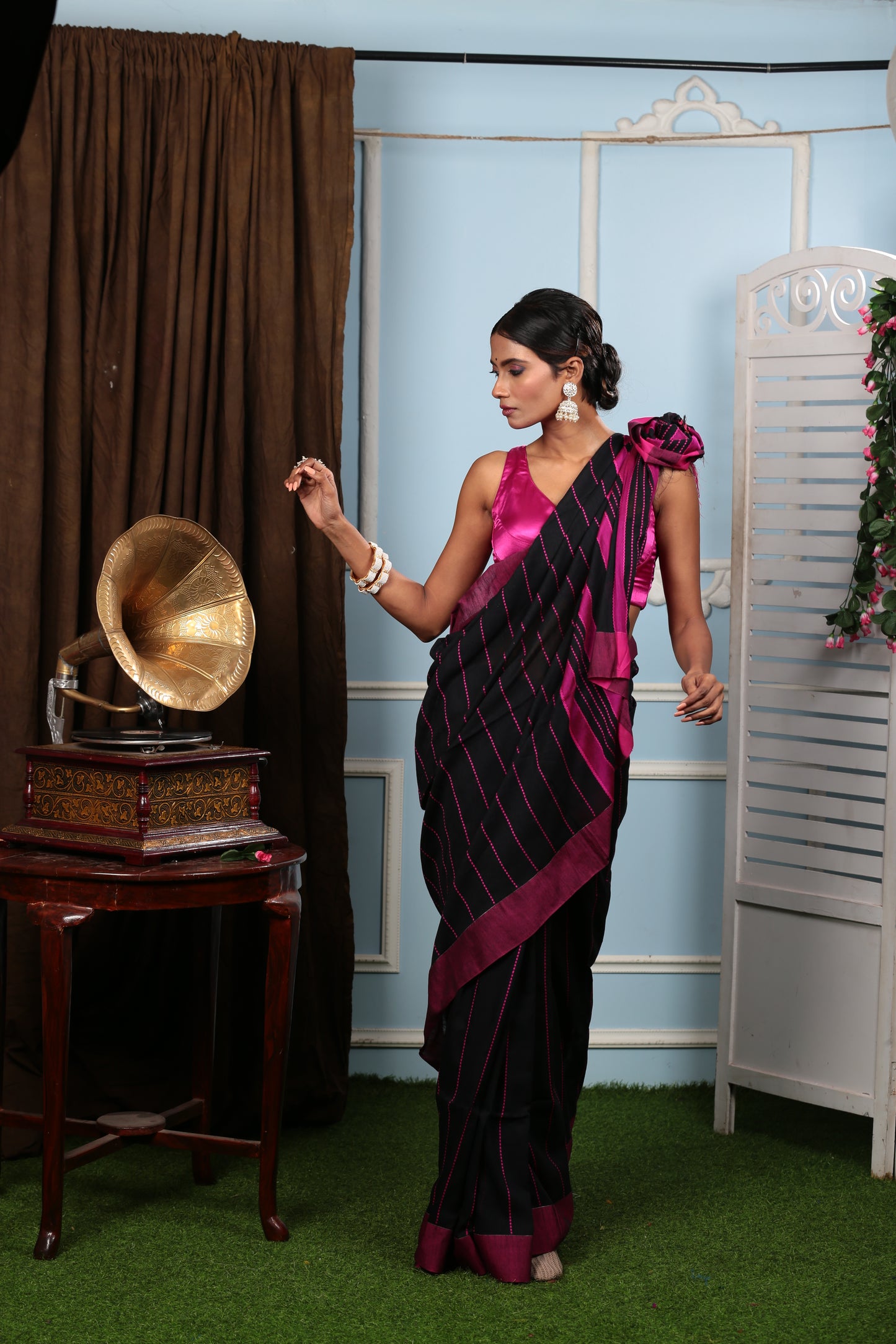 Model in black Bengal Khadi saree with maroon border and thin prints, ideal for corporate events | Urbane Essence