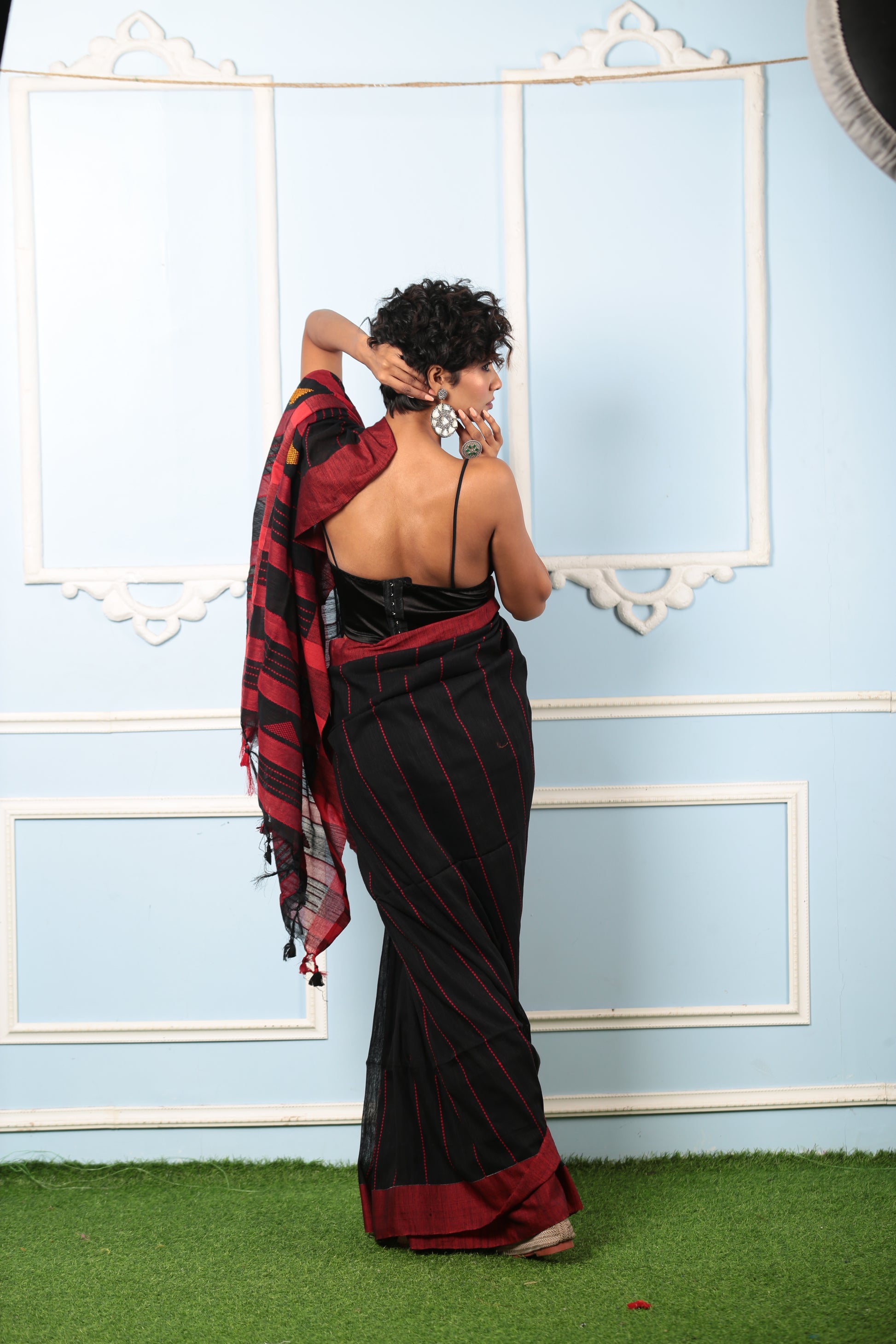 Model in black Bengal Khadi saree with broad maroon border, thin prints, perfect for official events | Urbane Essence