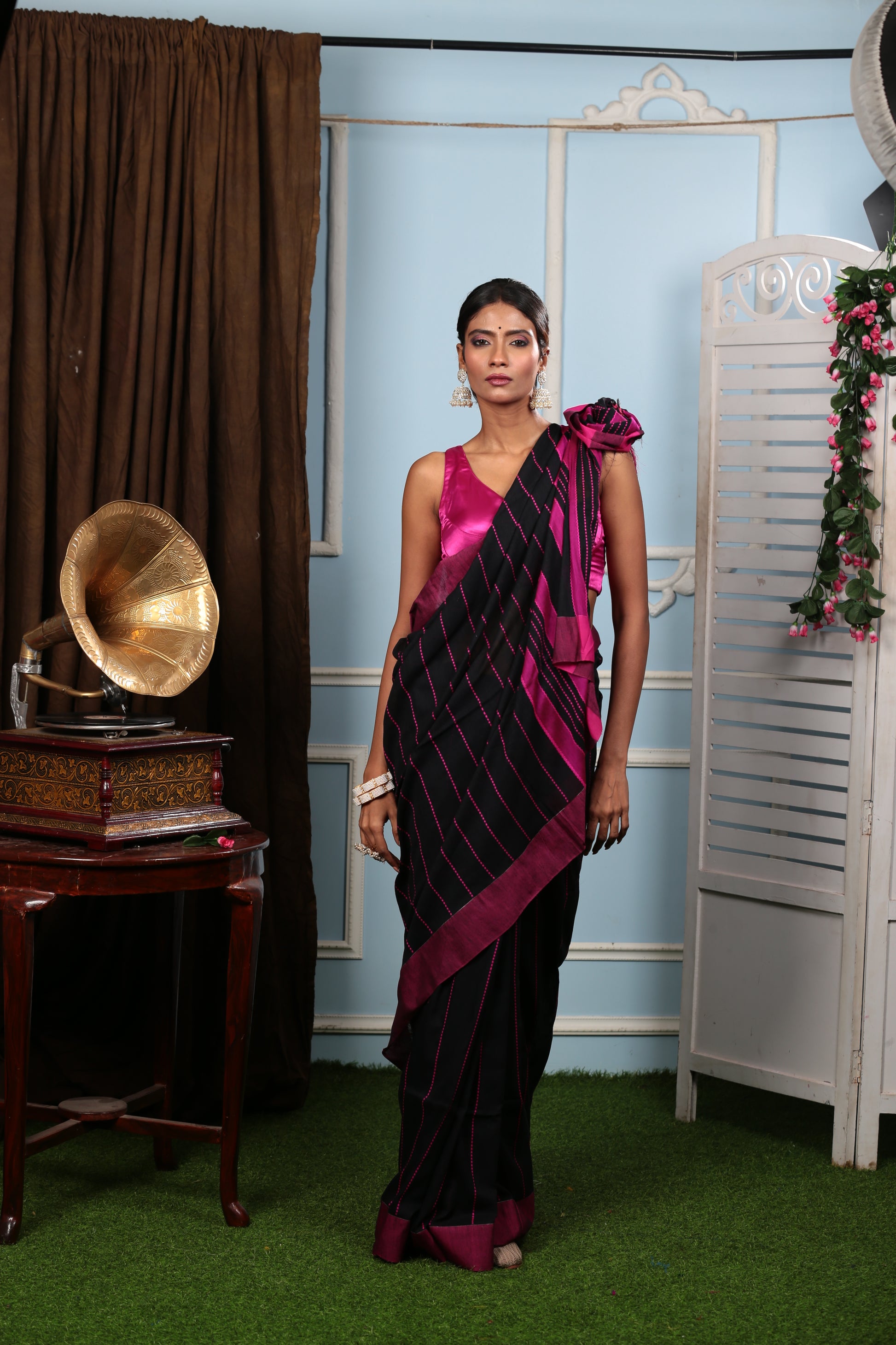 Woman in a black Bengal Khadi saree with maroon border and thin prints, suitable for official events | Urbane Essence