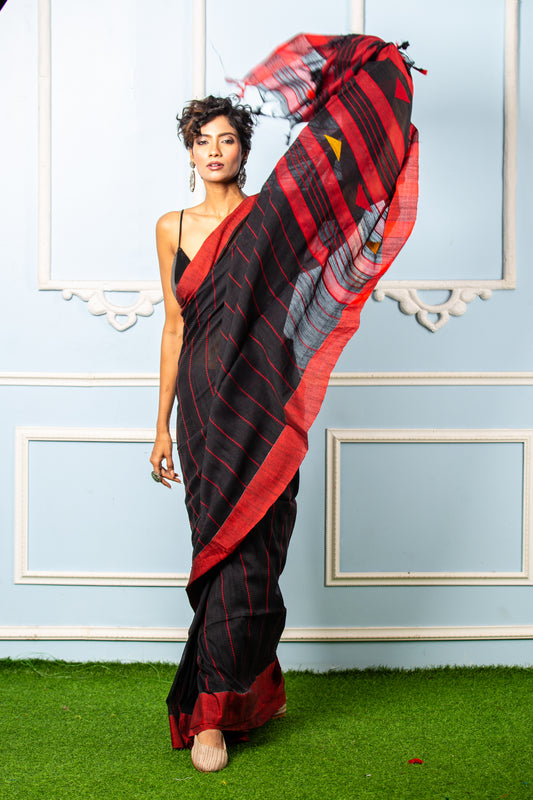 Model in black Bengal Khadi saree with broad red border, thin red prints, for official events | Urbane Essence