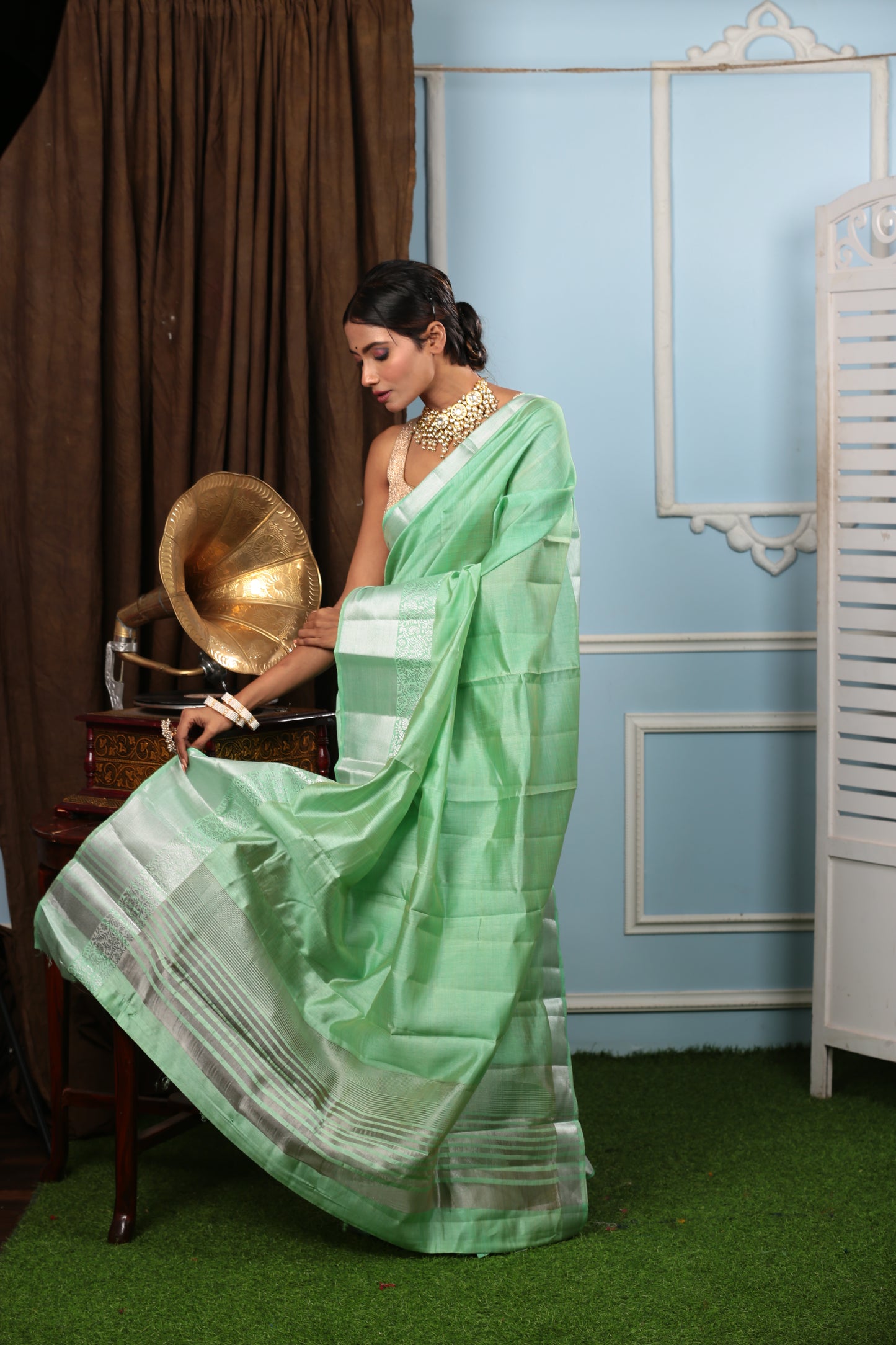 Mint green raw silk saree with silver borders, perfect for parties or conferences | Urbane Essence