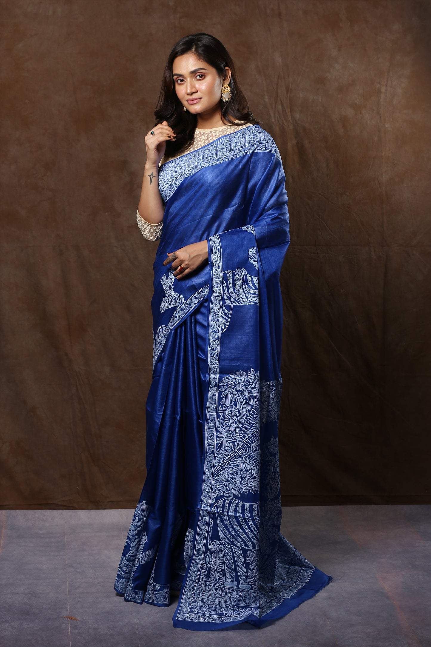 Blue Tussar silk saree with white Madhubani Zebra art, perfect for festive occasions | Urbane Essence