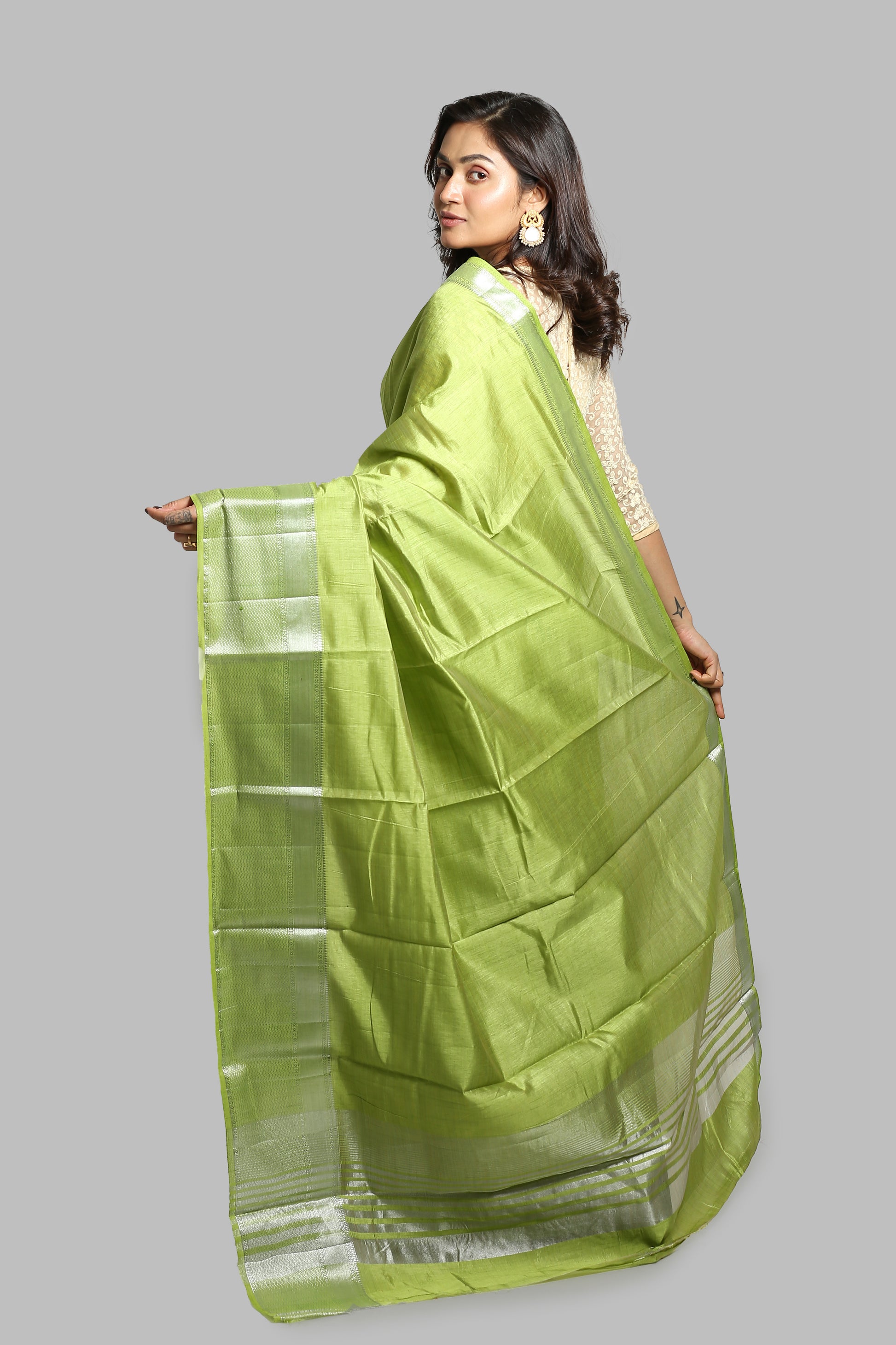 Aromatic Mead Raw Silk Saree: plain green body with silver zari border, traditional wear | Urbane Essence