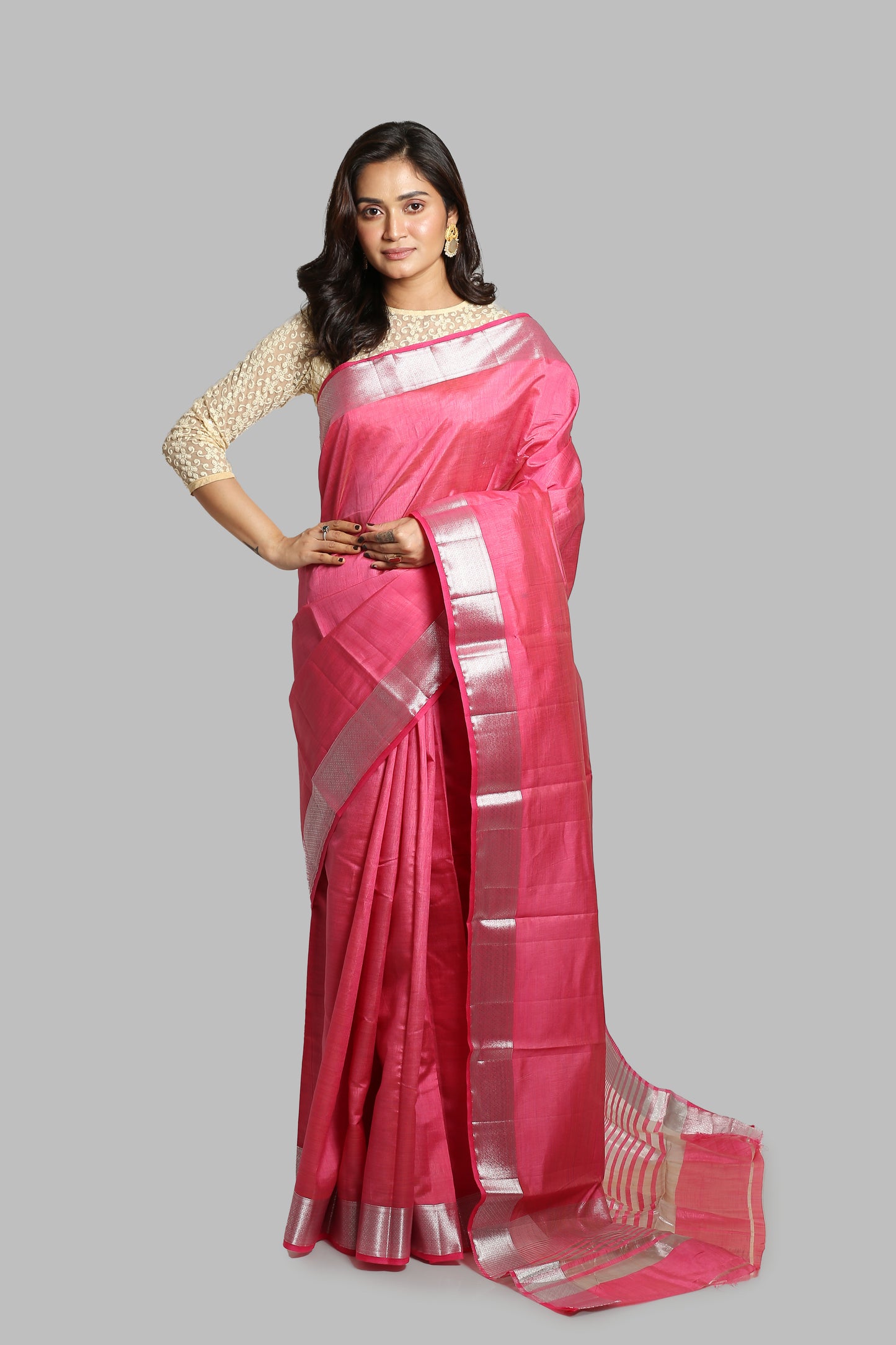 Flamingo pink raw silk saree with broad silver zari border, geometric pallu, perfect for professional wear | Urbane Essence