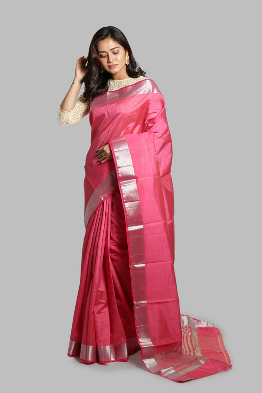 Flamingo pink raw silk saree with broad silver zari border, geometric pallu, perfect for professional wear | Urbane Essence