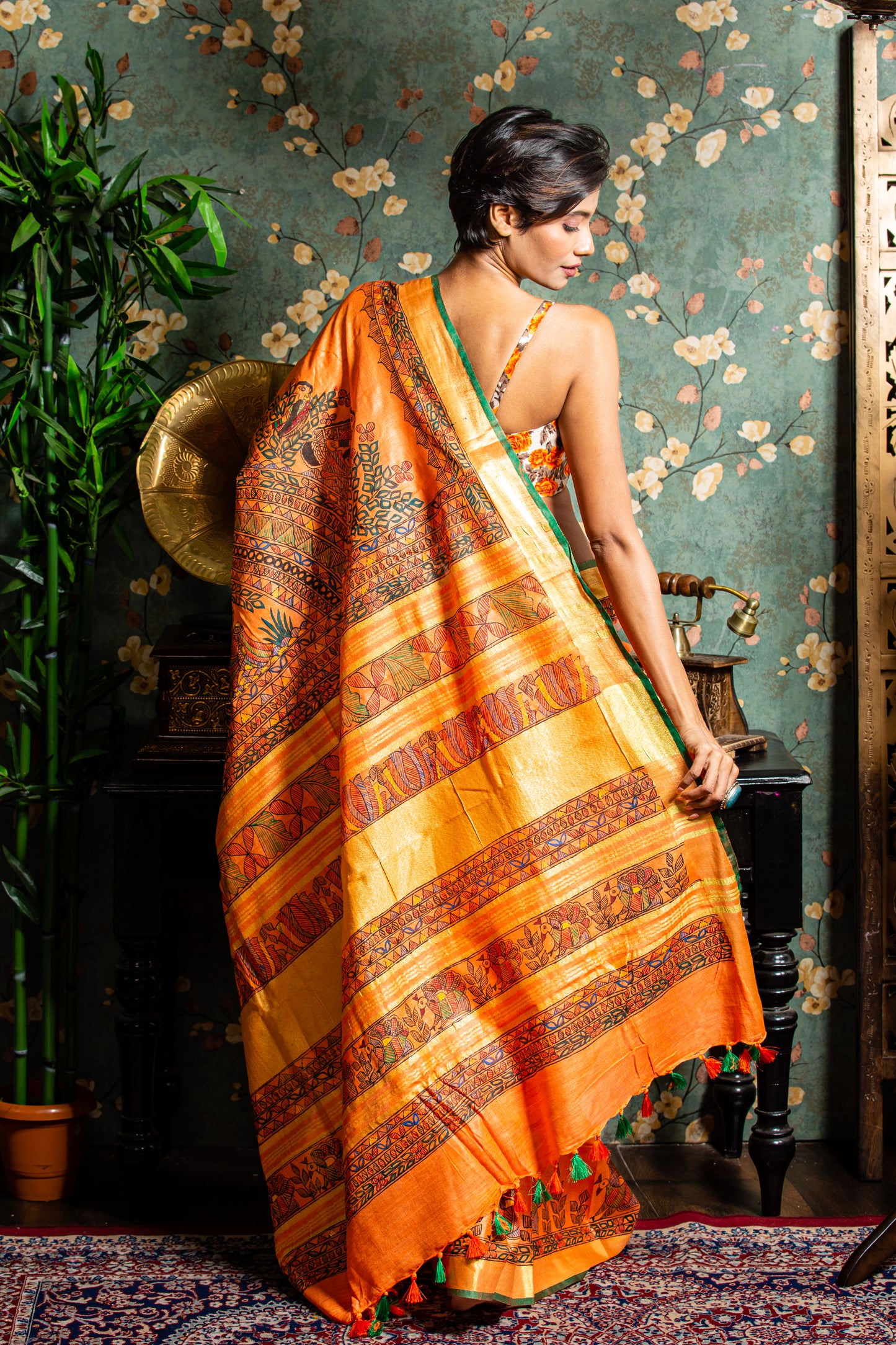 Orange Tussar silk Madhubani saree with intricate designs, perfect for glamorous evenings | Urbane Essence