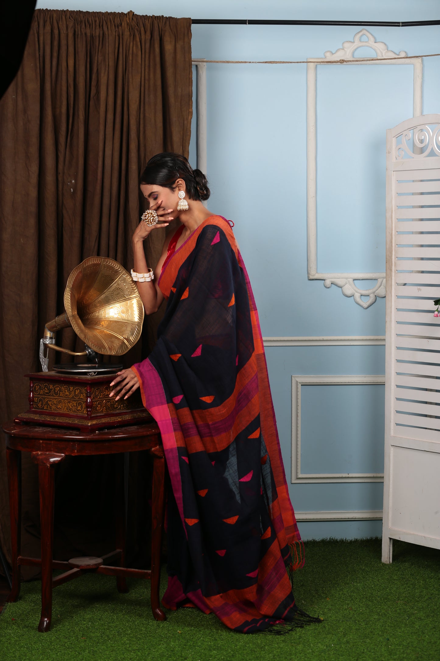 Assam Khadi saree: black base with multicolor patch patterns, broad purple border, perfect for summer events | Urbane Essence