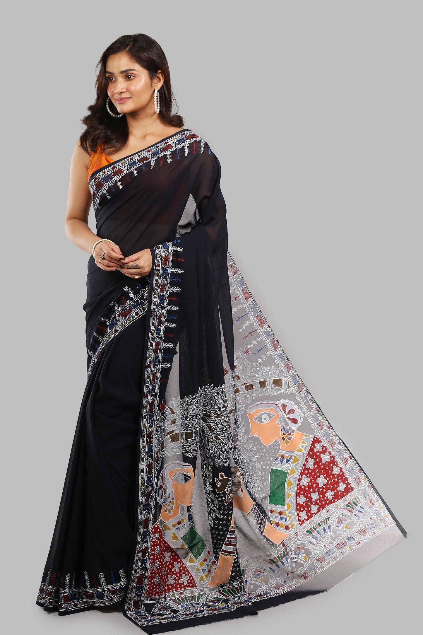 Charcoal synthetic saree with colorful human figures and patterns on the pallu, suitable for festive occasions | Urbane Essence