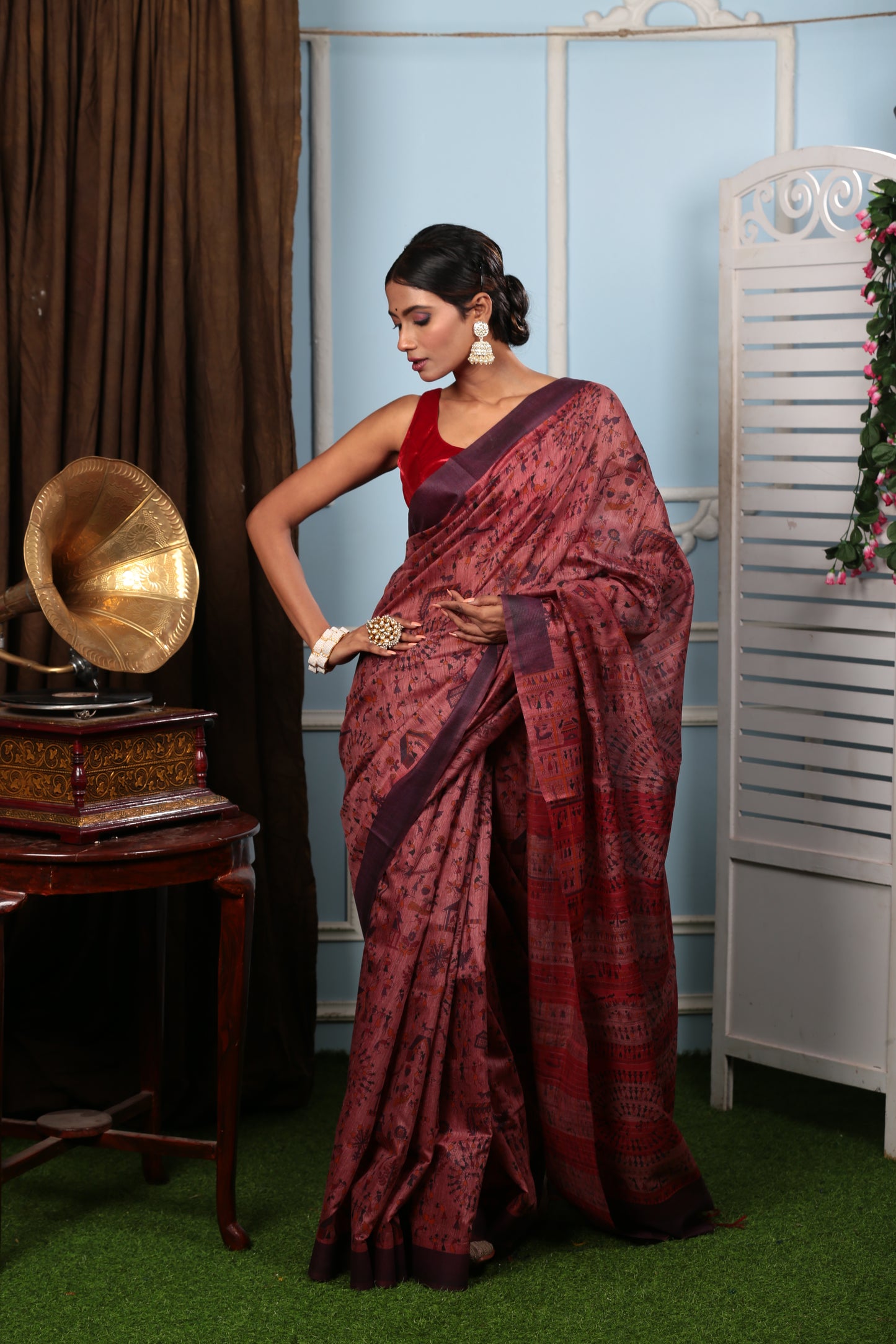 Rust silk saree with all-over Warli tribal painting, perfect for festive occasions. | Urbane Essence