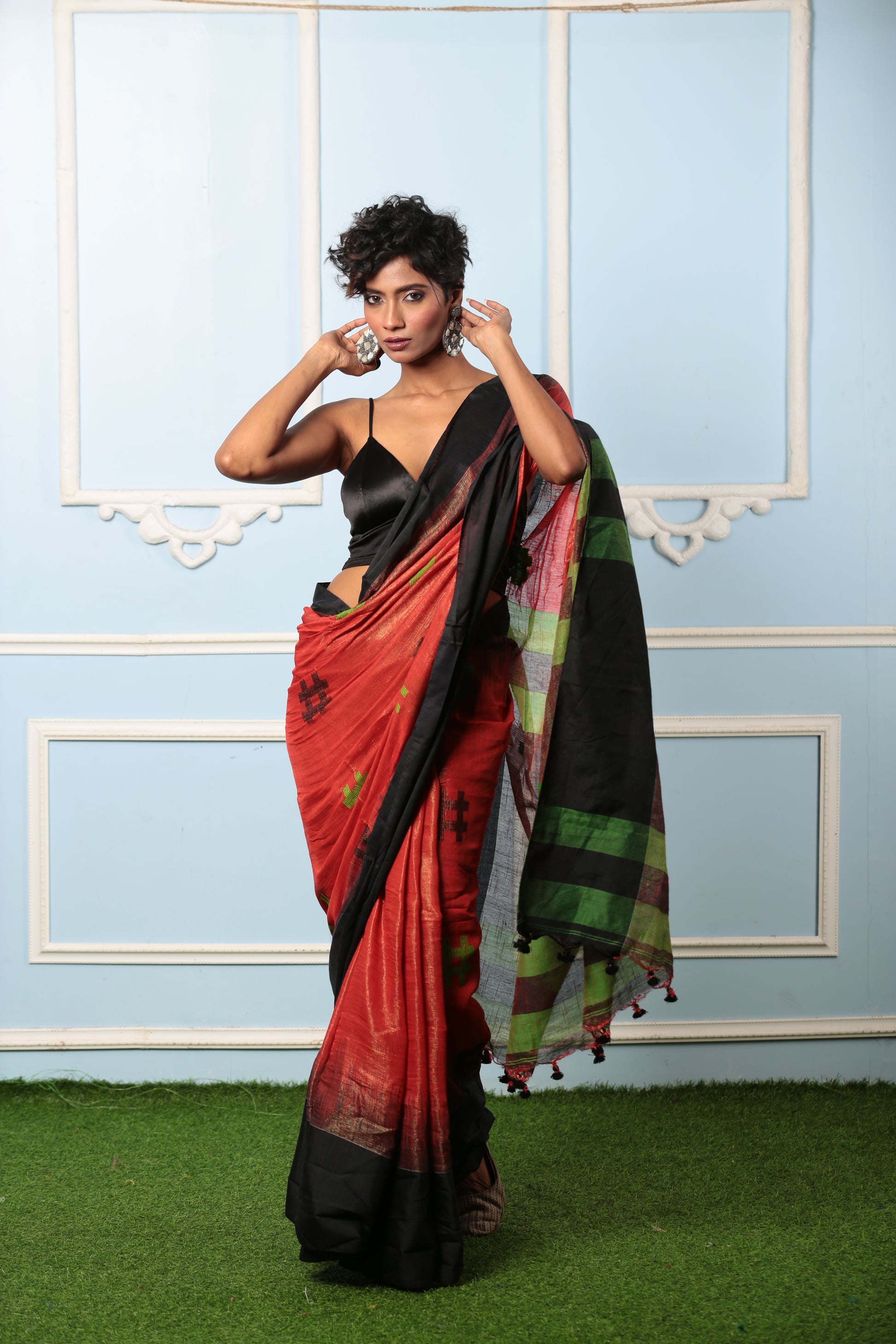 Red raw silk saree with black border and green stripes, perfect for festive occasions | Urbane Essence