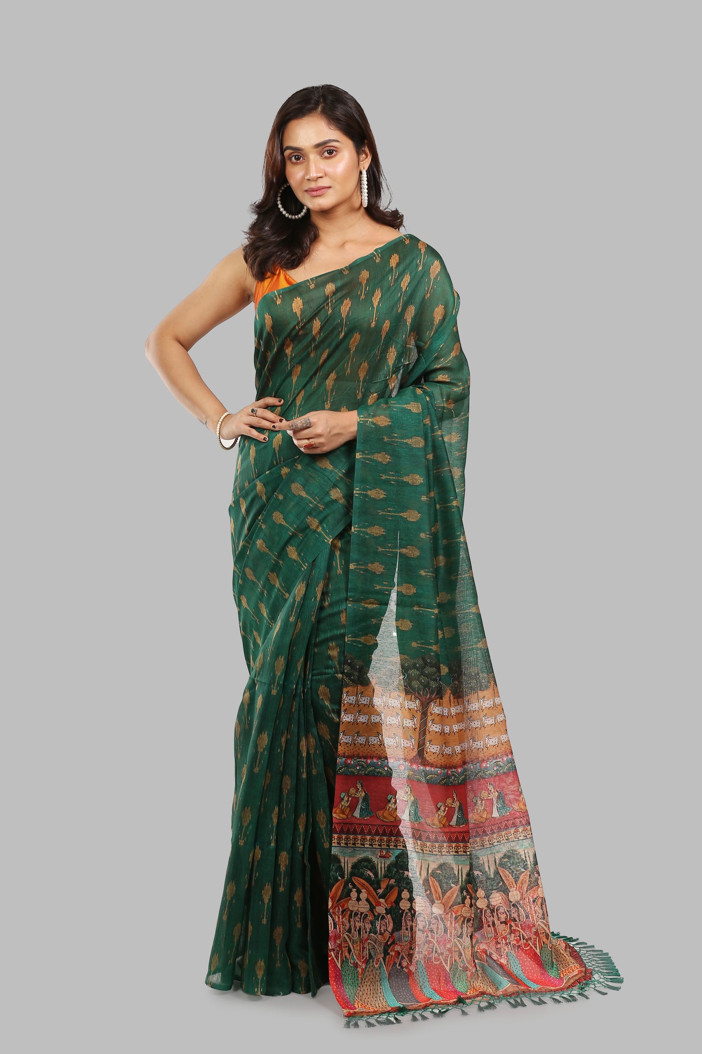 Deep green raw silk saree with all-over patterns and ancient wall painting pallu, perfect for traditional occasions | Urbane Essence
