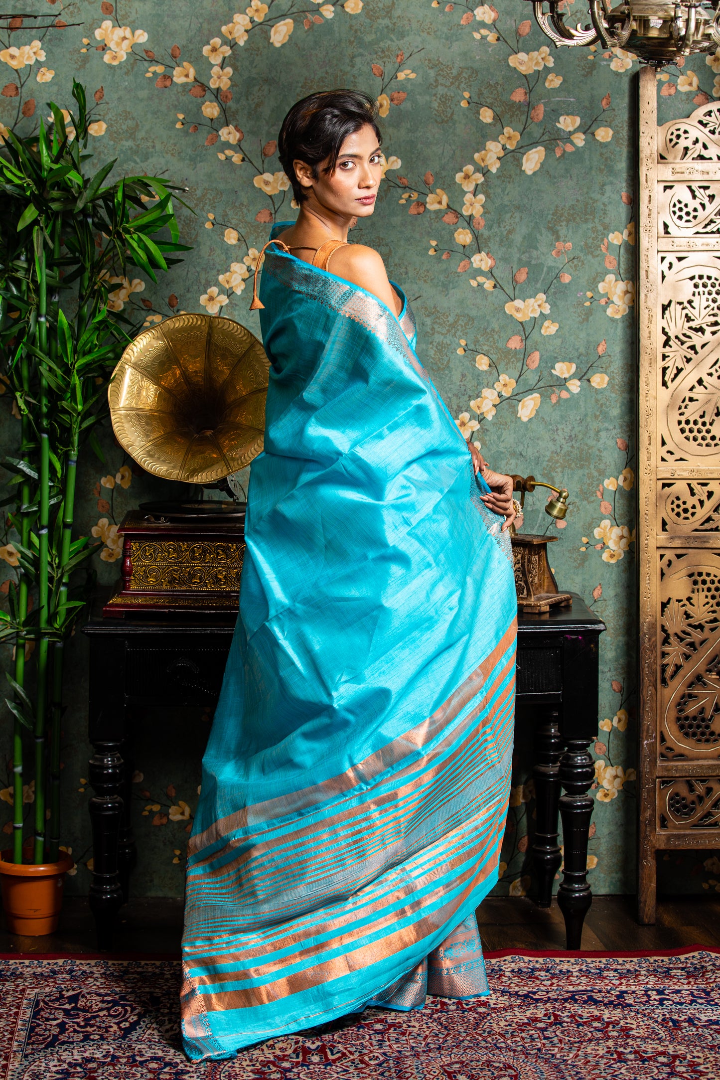 Elegant raw silk saree in baby blue with copper accents, perfect for festive occasions | Urbane Essence