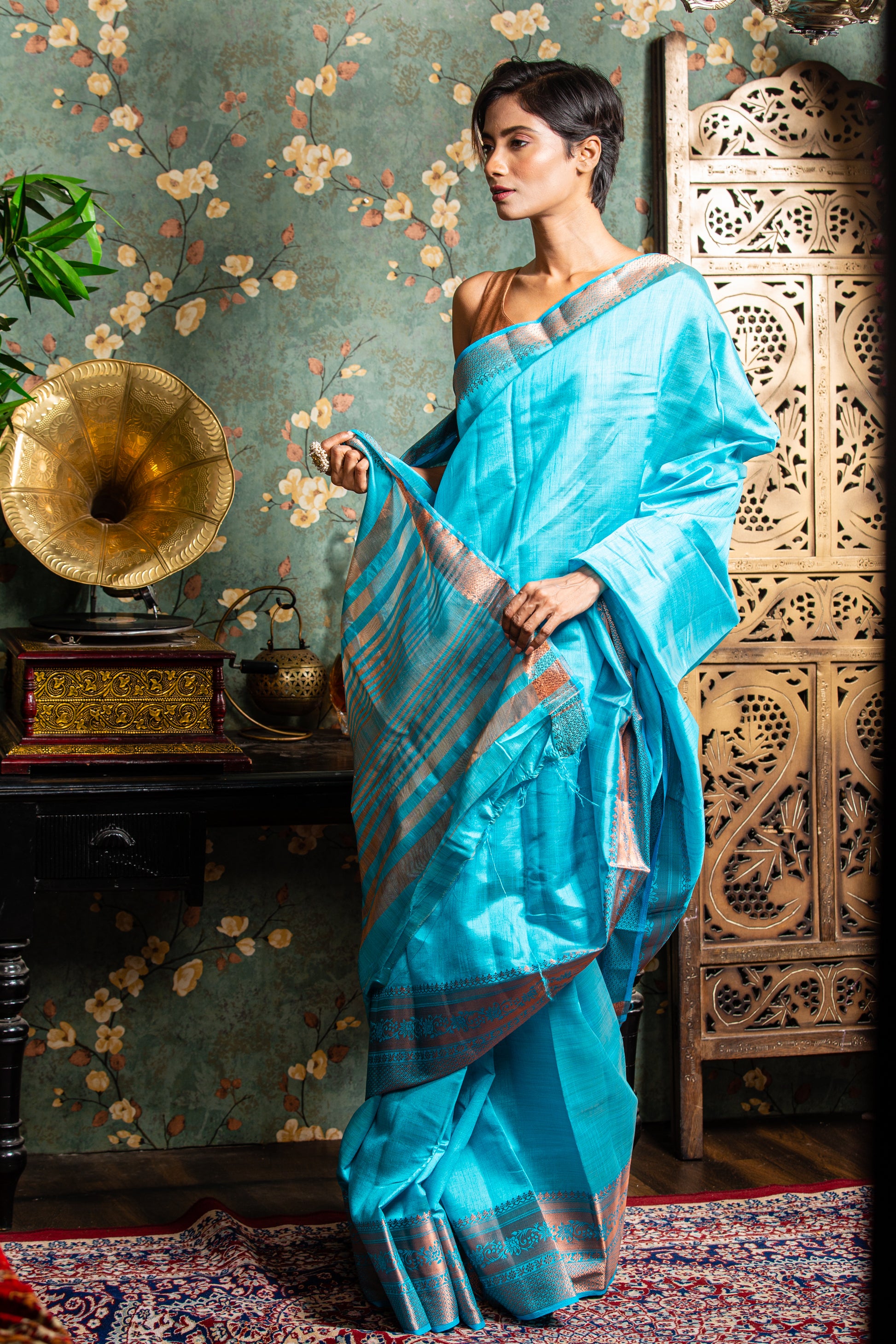 Baby blue raw silk saree with copper border, ideal for festive occasions. | Urbane Essence