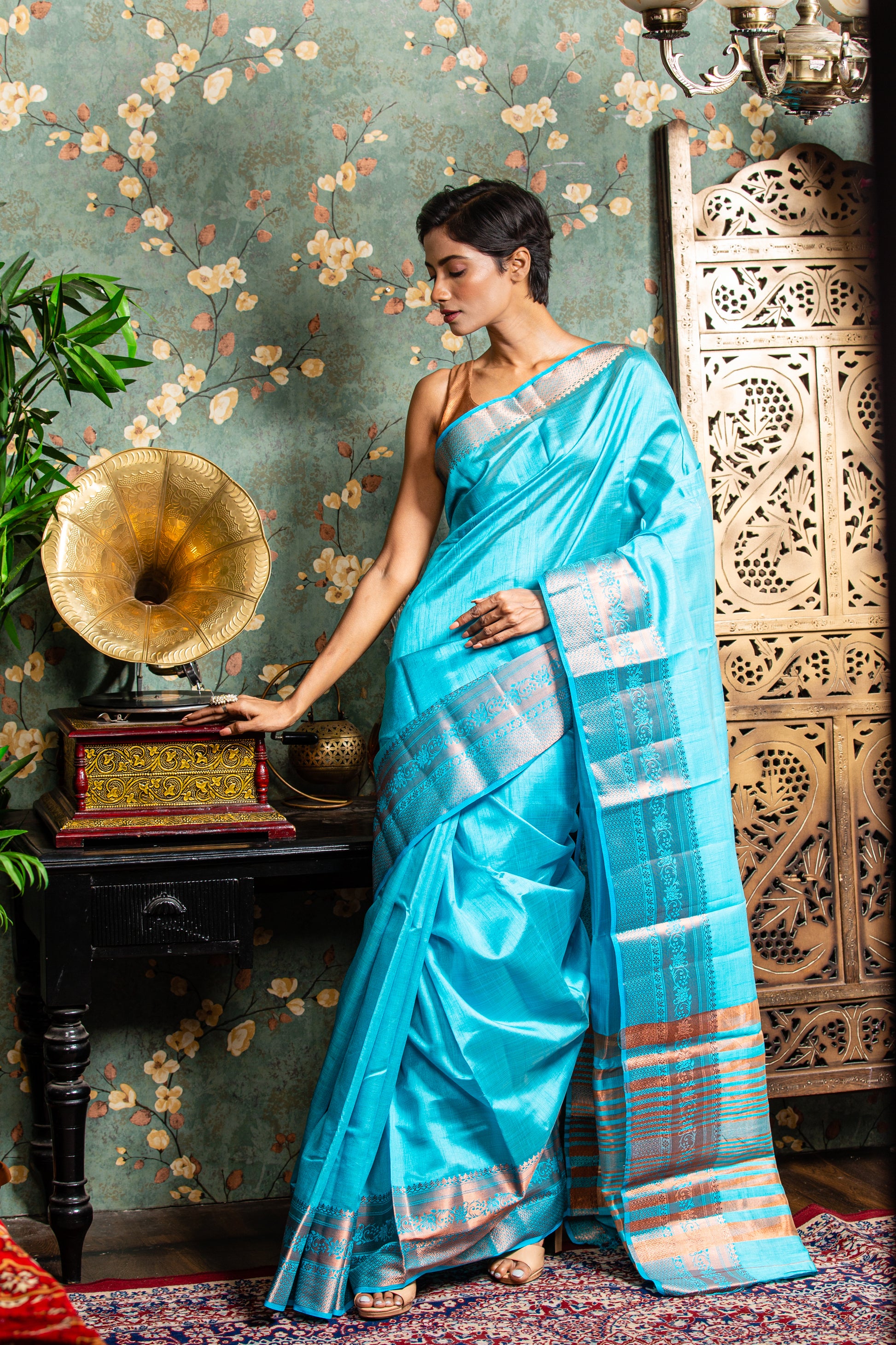 Elegant baby blue raw silk saree with copper accents, perfect for festive occasions. | Urbane Essence