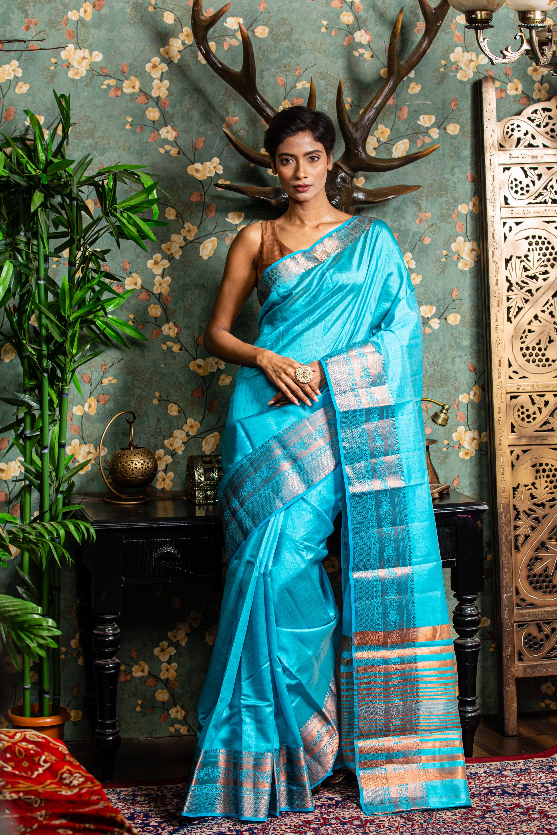 Raw silk saree in baby blue with copper accents, ideal for festive occasions. | Urbane Essence