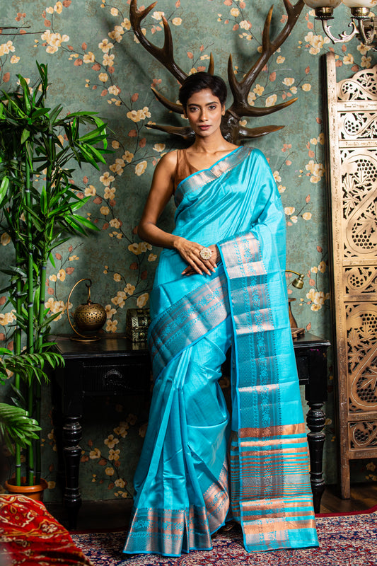 Raw silk saree in baby blue with copper accents, ideal for festive occasions. | Urbane Essence