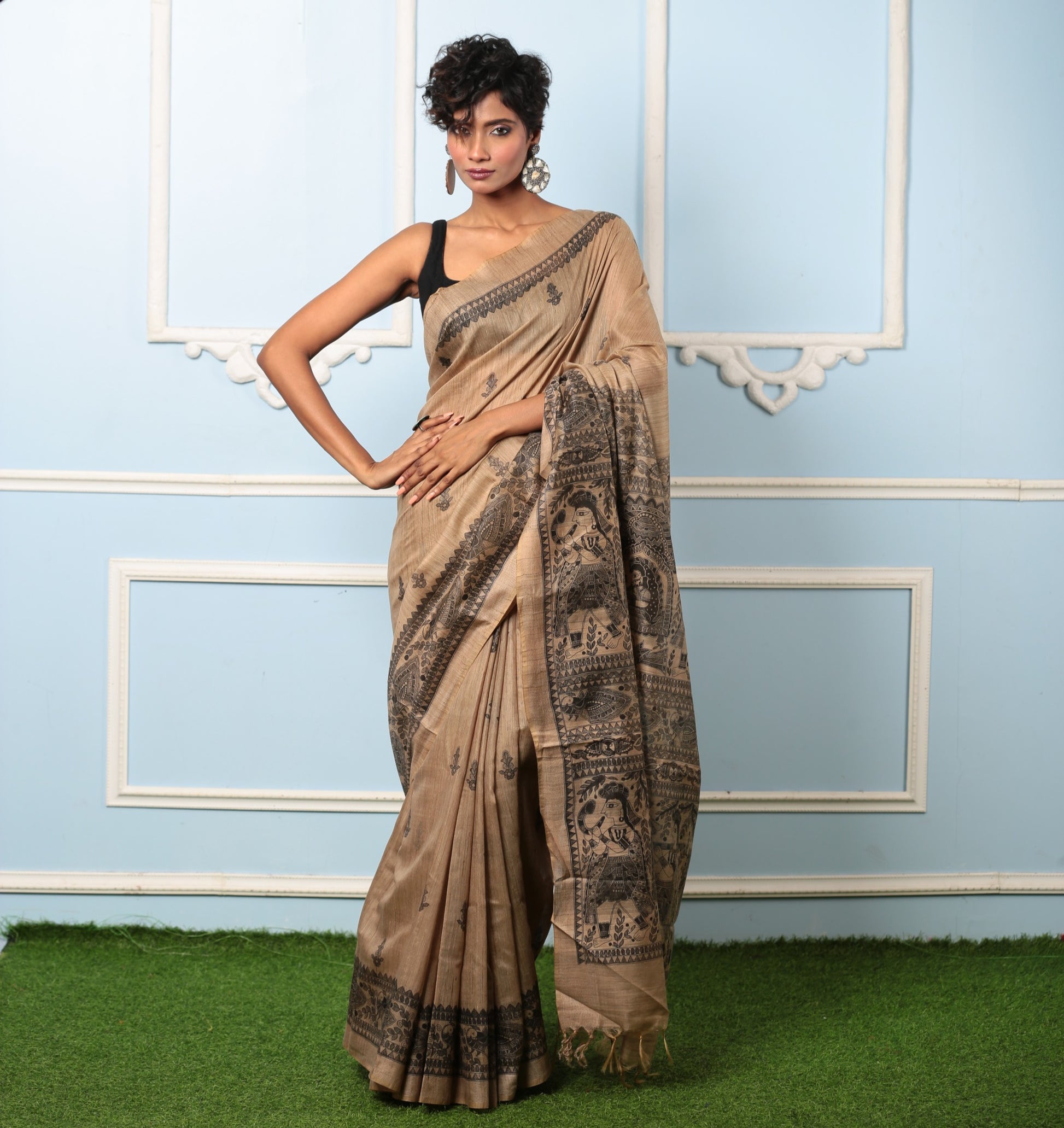 Elegant beige silk Madhubani saree with black ink princess tale design, perfect for gifting | Urbane Essence