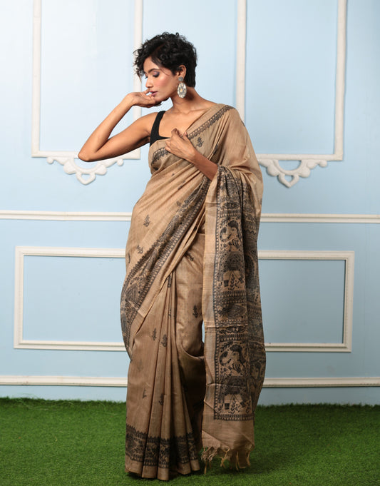 Elegant beige silk Madhubani saree with black ink princess tale design, perfect for gifting | Urbane Essence