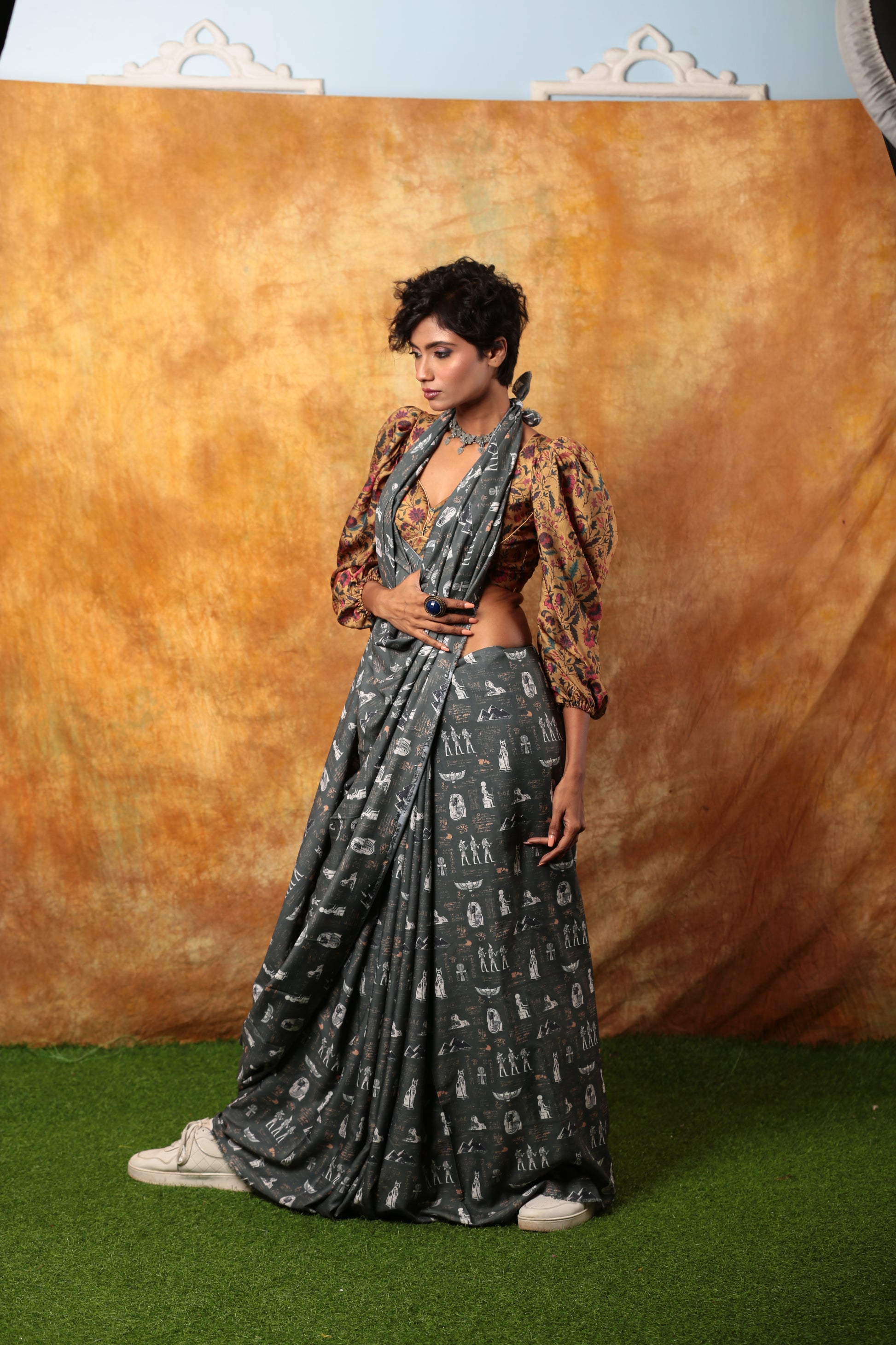 Grey Egyptian print saree with white hieroglyphs, paired with a patterned blouse, suitable for unique occasions | Urbane Essence