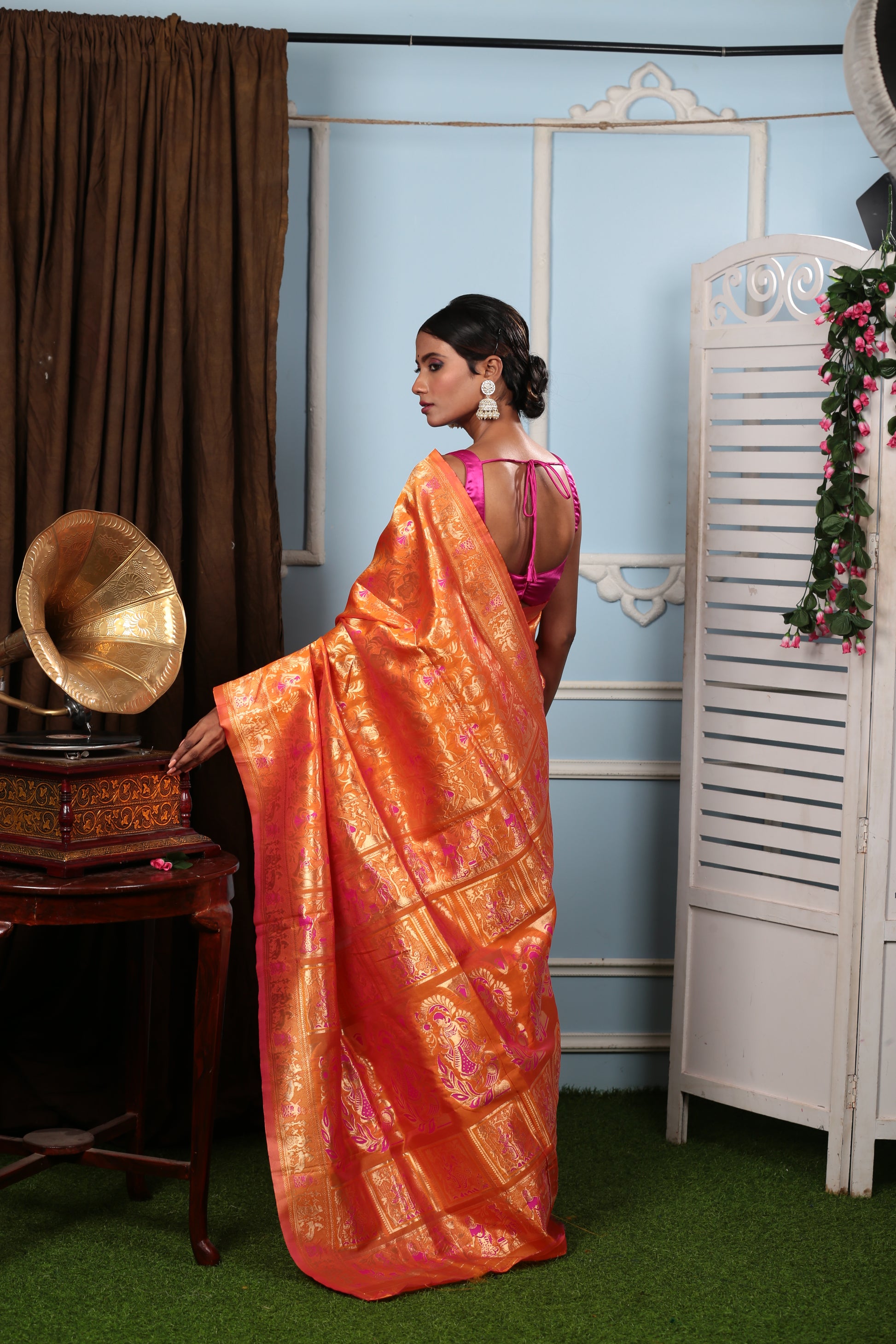 Elegant tangerine Baluchari silk saree with intricate mythological pallu, perfect for special occasions | Urbane Essence