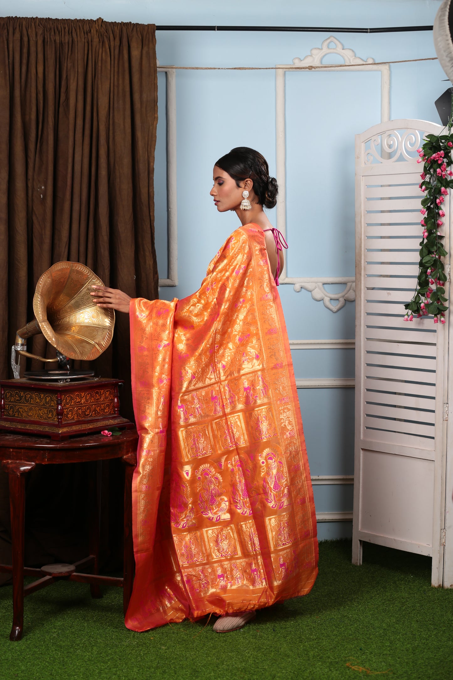Elegant tangerine Baluchari silk saree with mythological pallu, perfect for special occasions | Urbane Essence