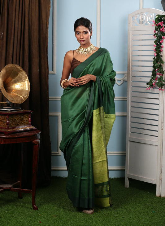 Elegant green Tussar silk saree with a contrasting pallu, perfect for festive occasions. | Urbane Essence