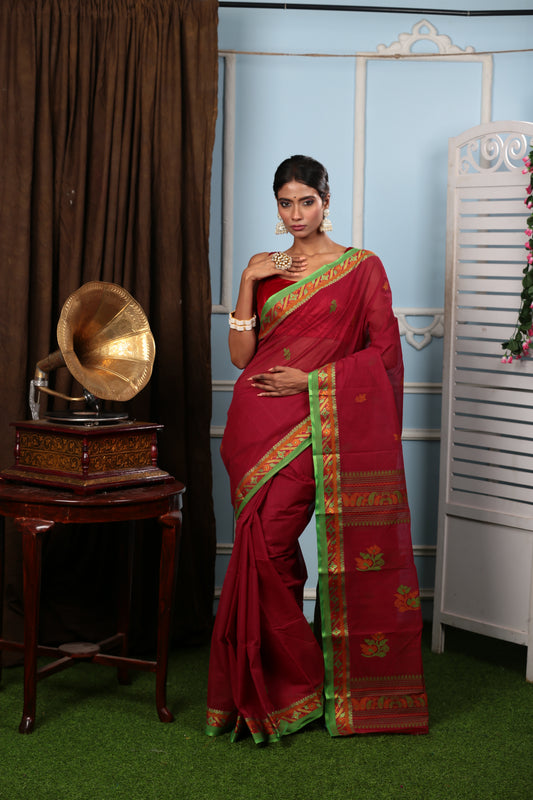 Elegant red Tant saree with green border, floral pallu, perfect for festive occasions | Urbane Essence