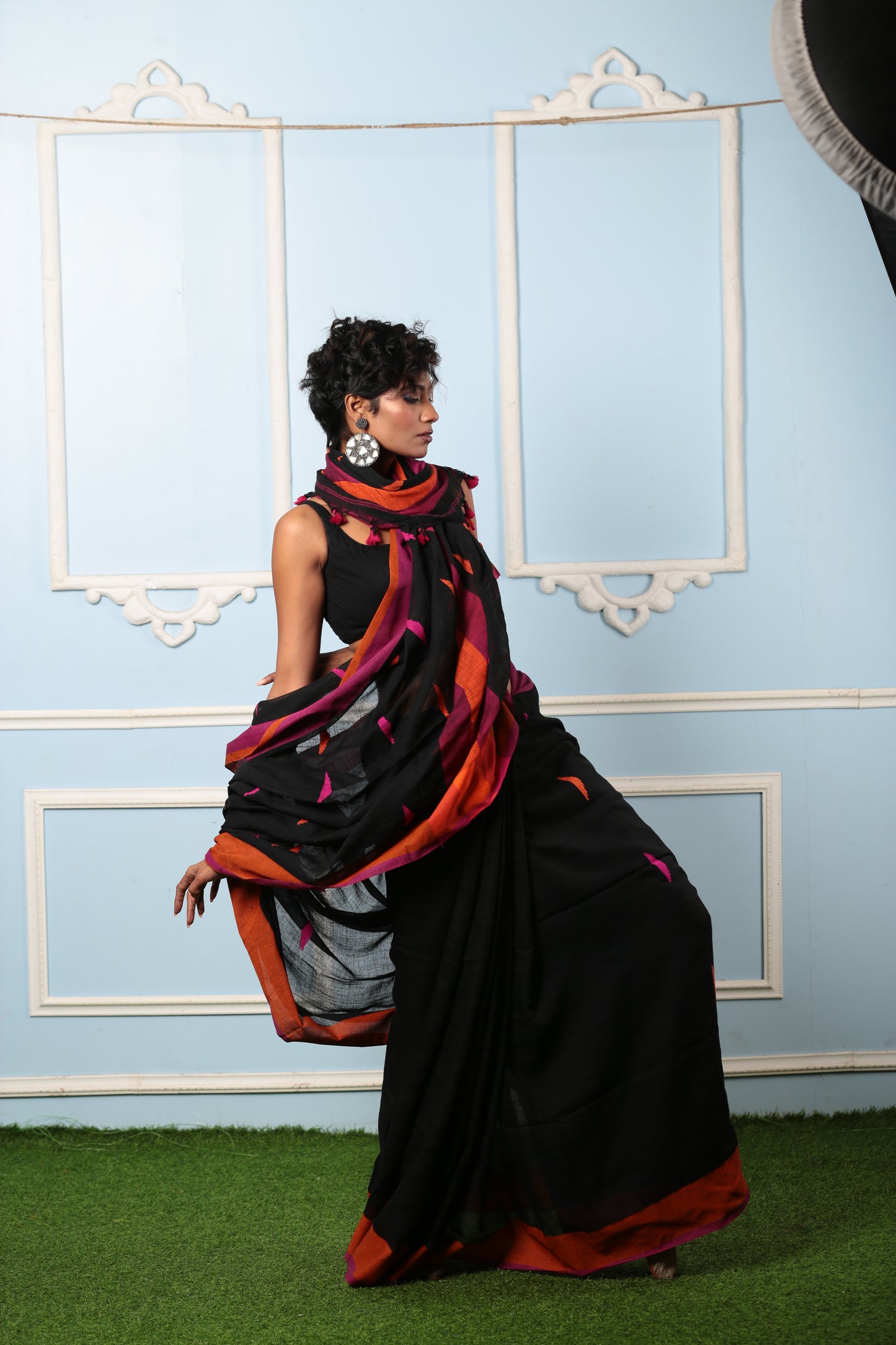 Black Bengal Khadi saree with broad orange and purple border, perfect for a subtle style statement | Urbane Essence