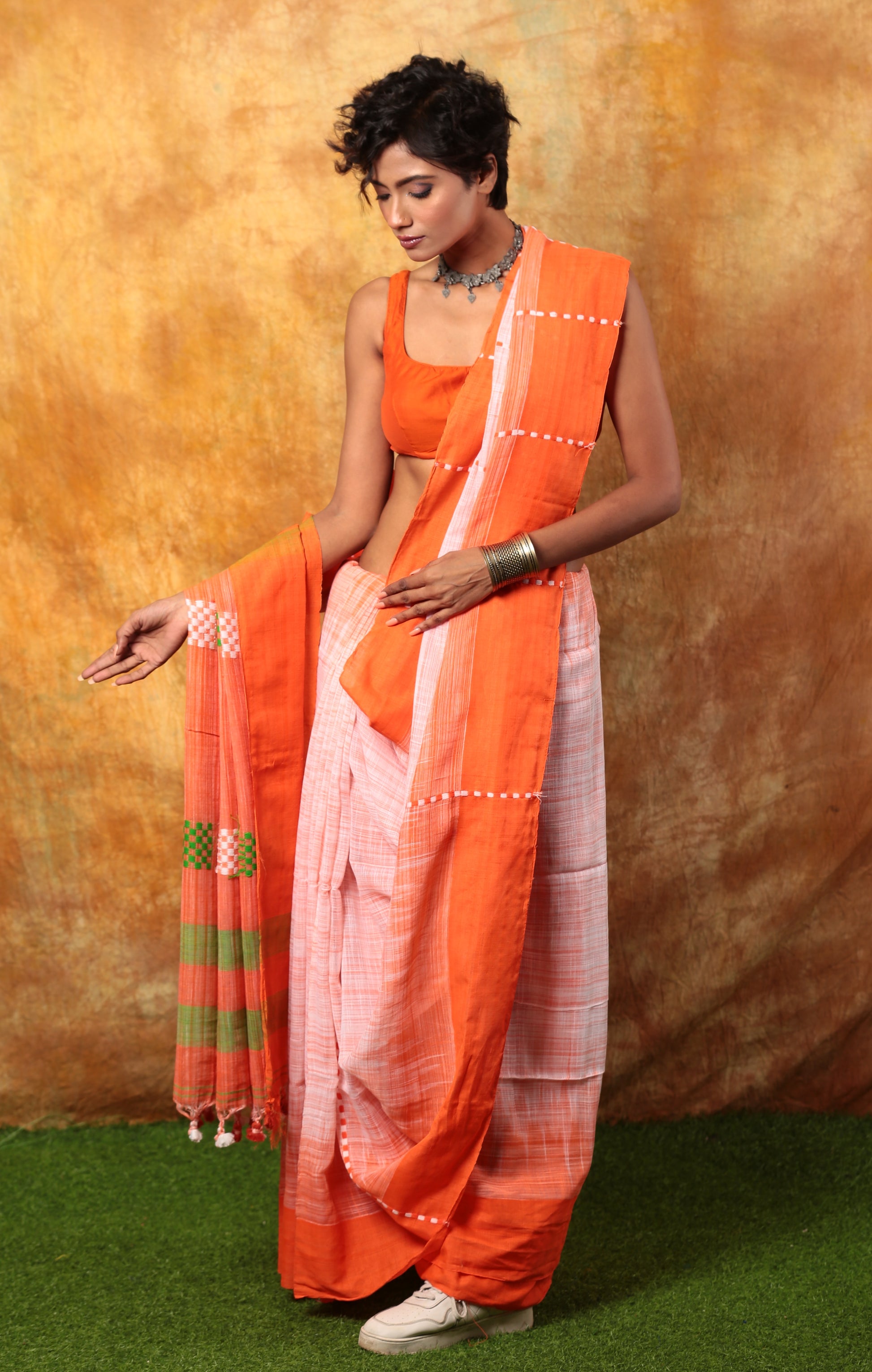 Assam Khadi saree in orange, white, and green with thin checker pattern, ideal for day events | Urbane Essence