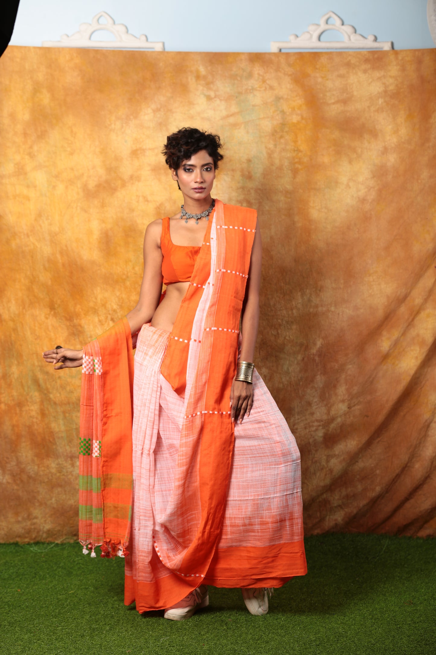Assam Khadi saree in orange, white, green with checker pattern, ideal for day events. | Urbane Essence