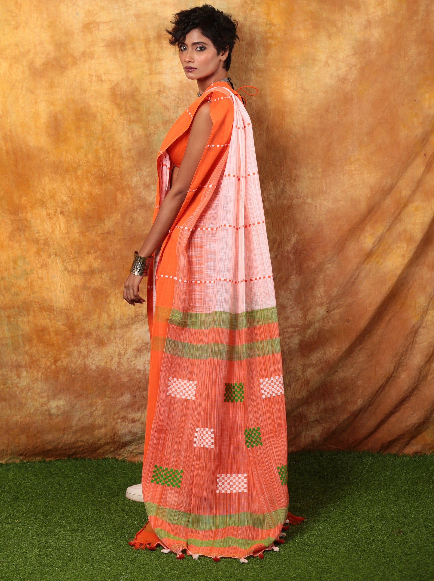 Assam Khadi saree in orange, white, green with checker pattern, perfect for day events | Urbane Essence