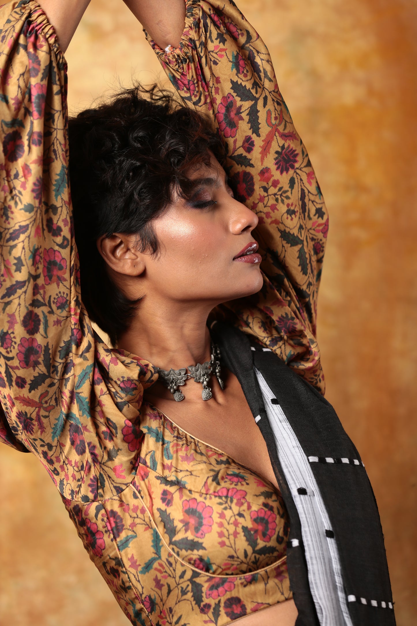 Model in a white and black Assam Khadi saree with traditional patterns, ideal for summer mornings | Urbane Essence