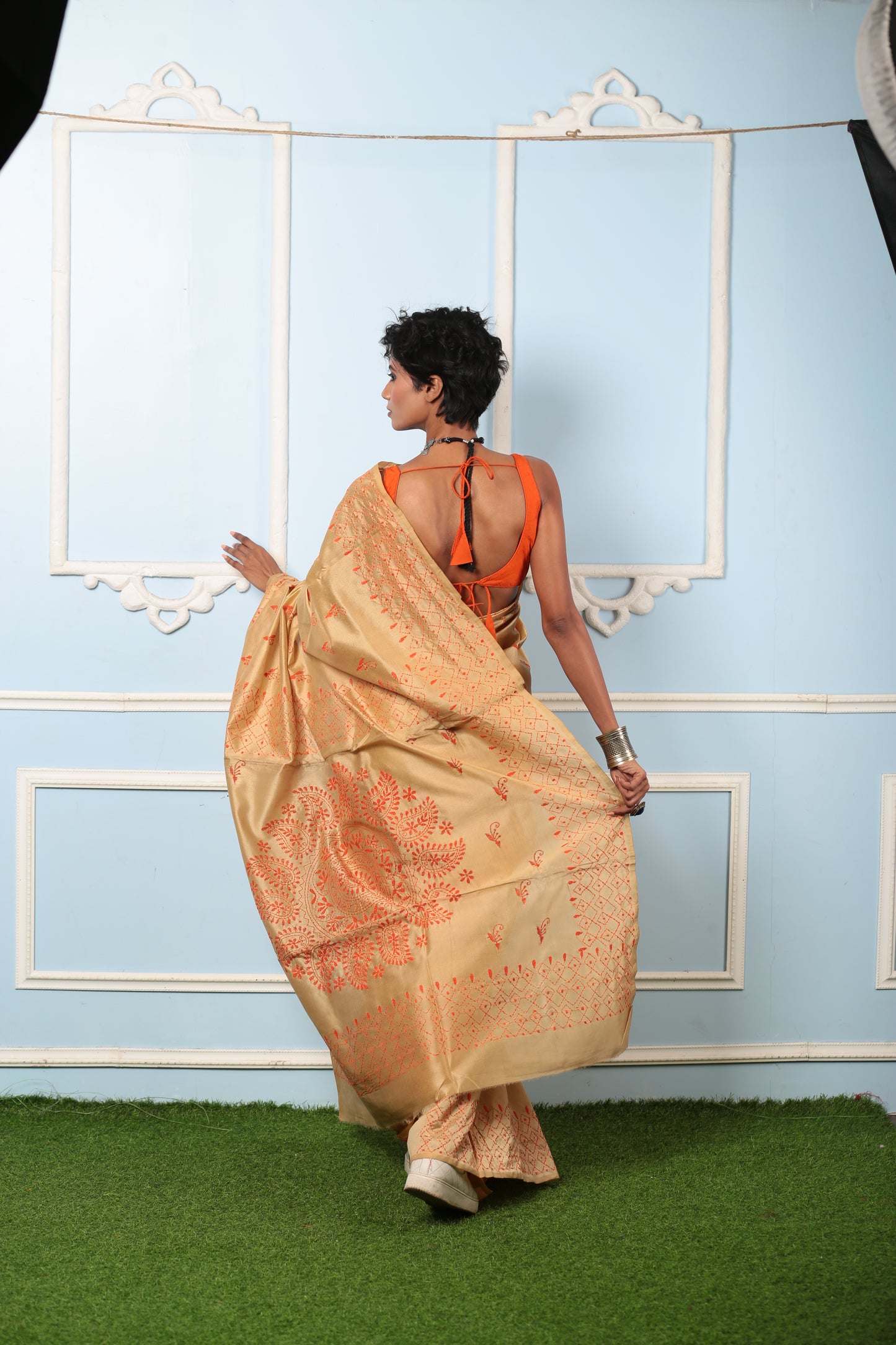 Beige Kantha silk saree with orange stitch patterns, paired with an orange blouse, perfect for traditional events | Urbane Essence