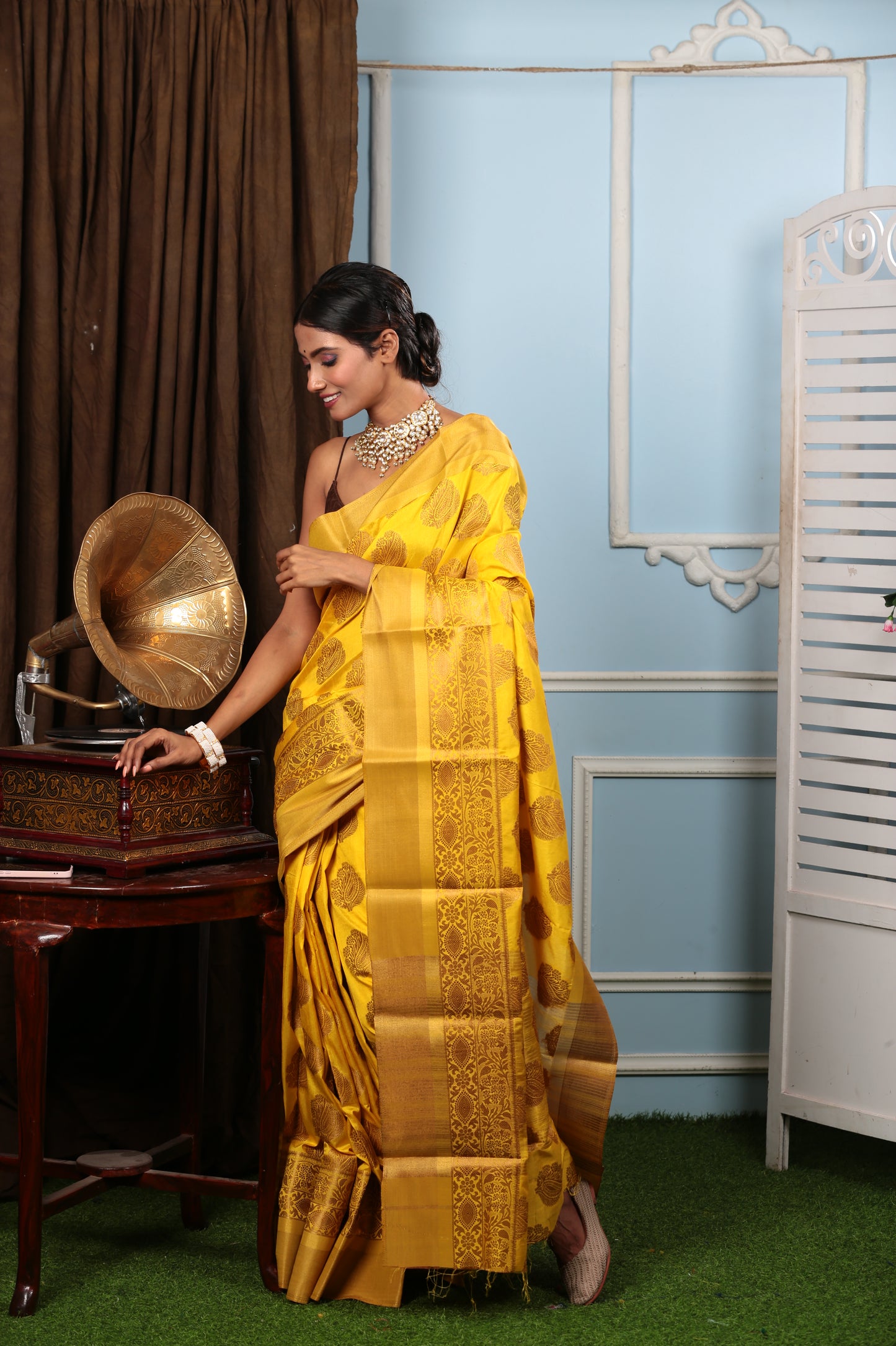 Bright yellow South silk saree with brown border, ideal for fun events. | Urbane Essence