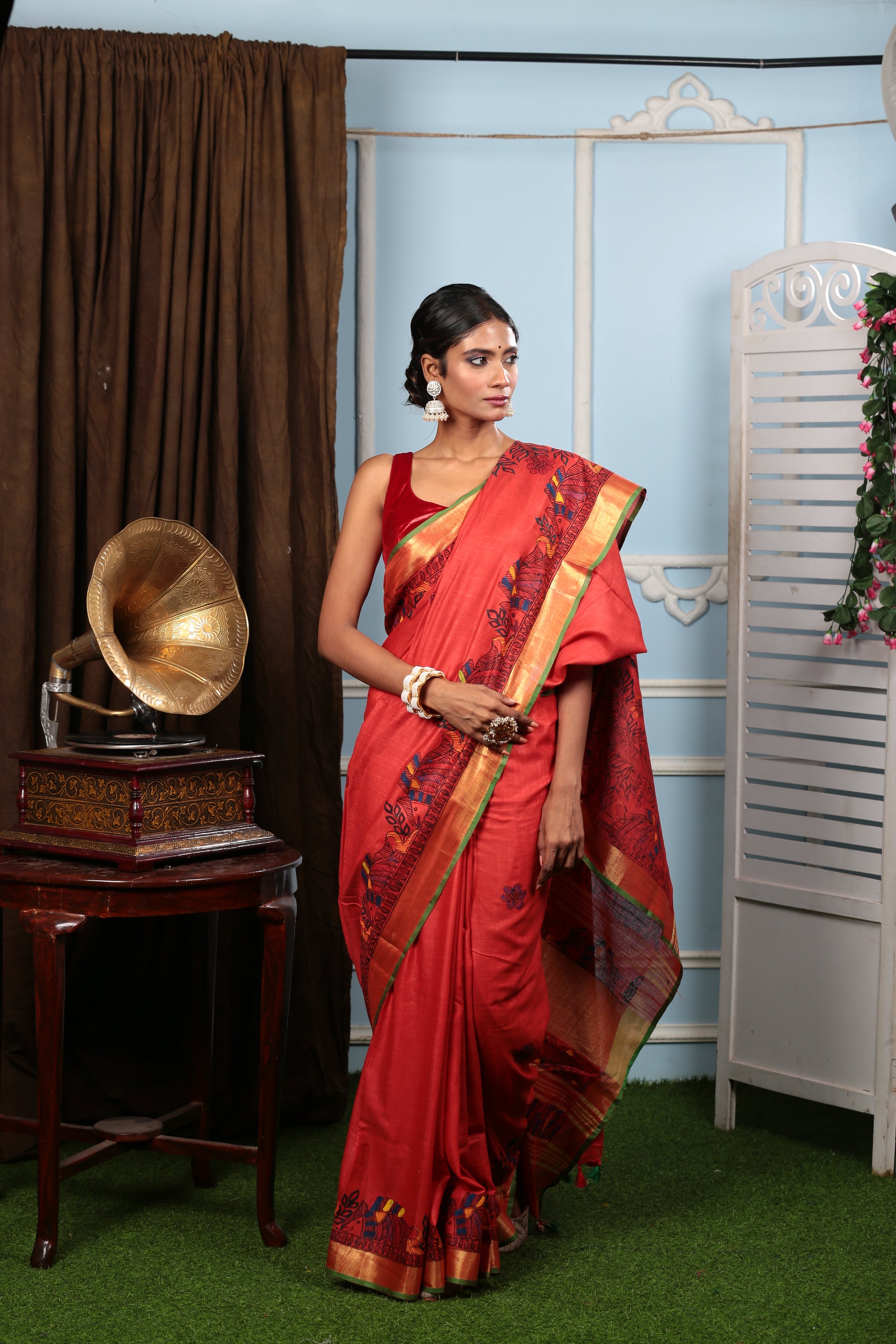 Fiery red Madhubani art saree with yellow-green border, perfect for weddings. | Urbane Essence