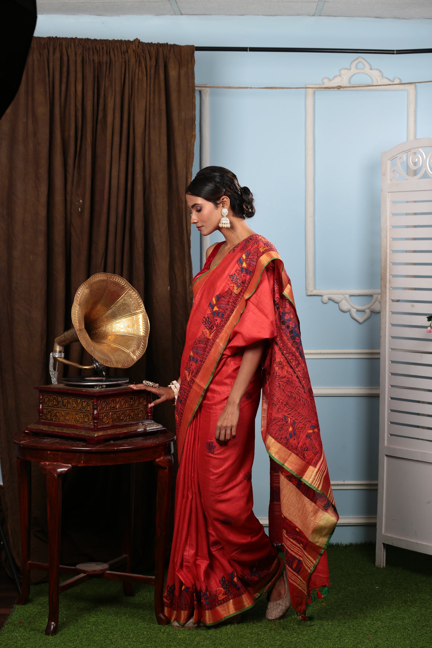 Fiery red Madhubani art saree with yellow-green border, perfect for weddings | Urbane Essence