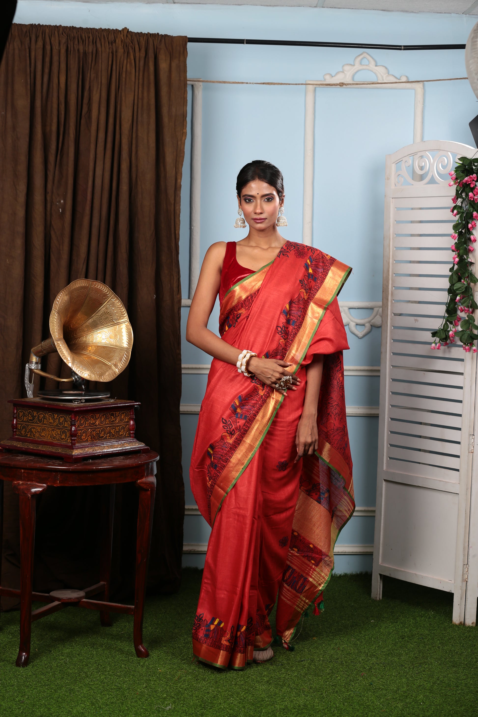 Fiery red Madhubani art tussar silk saree with yellow-green border, ideal for weddings | Urbane Essence