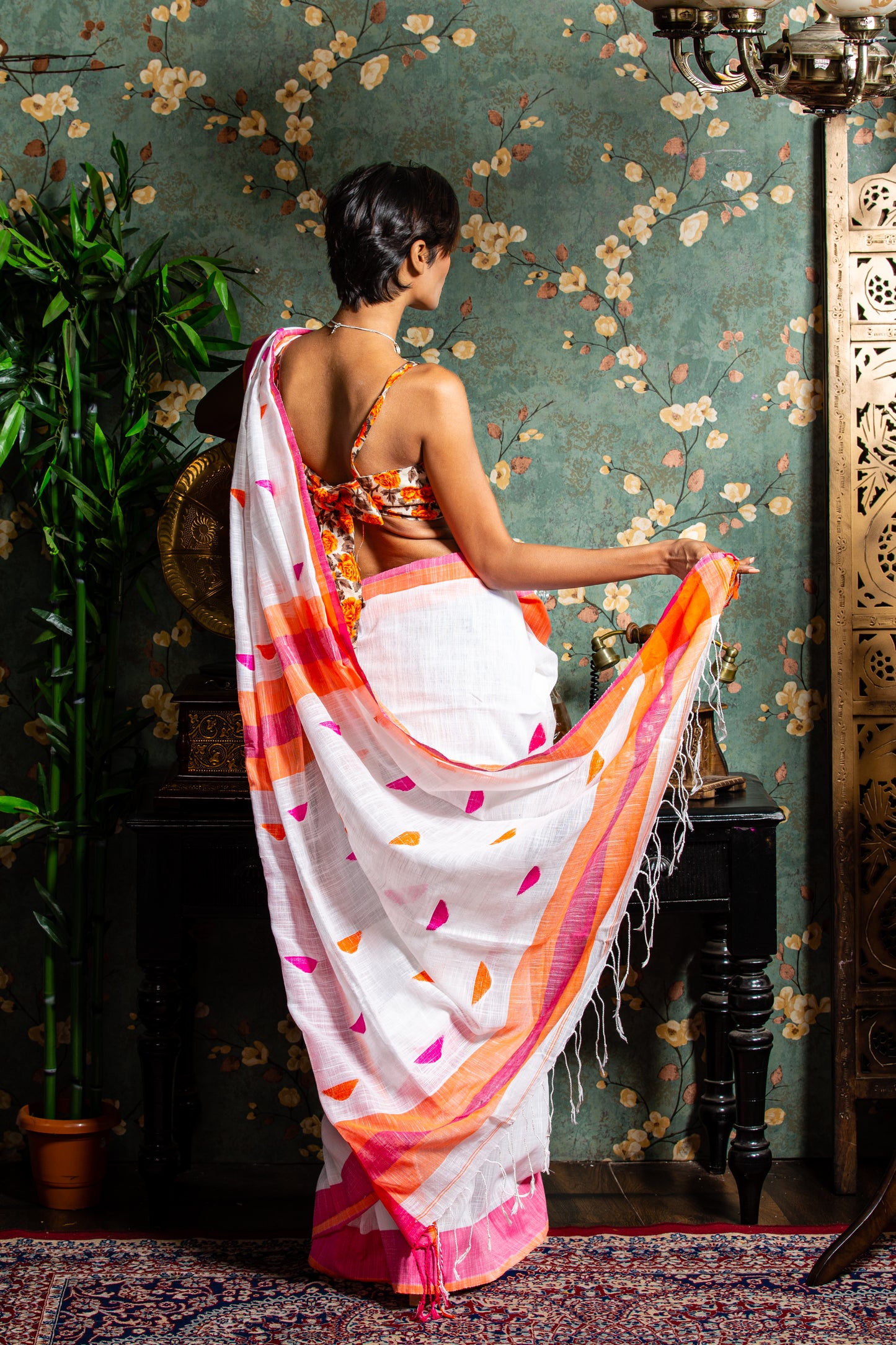 Assam Khadi Saree: White and pink handloom saree with orange/yellow borders, perfect for festive occasions | Urbane Essence