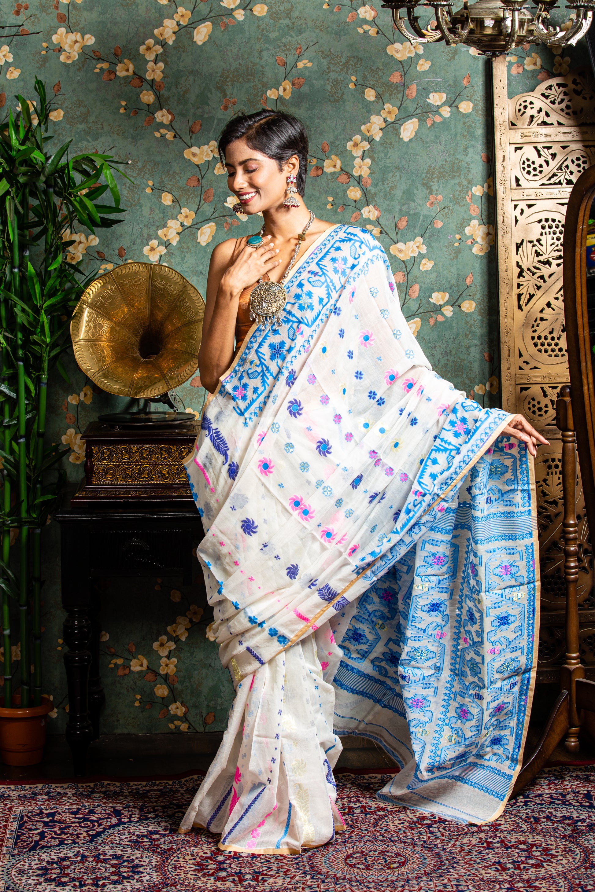 White cotton Jamdani saree with blue and pink handloom motifs, perfect for Pujas or work | Urbane Essence