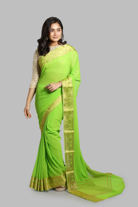 Green chiffon-blend saree with broad golden floral zari border and busy pallu design, perfect for daily wear. | Urbane Essence