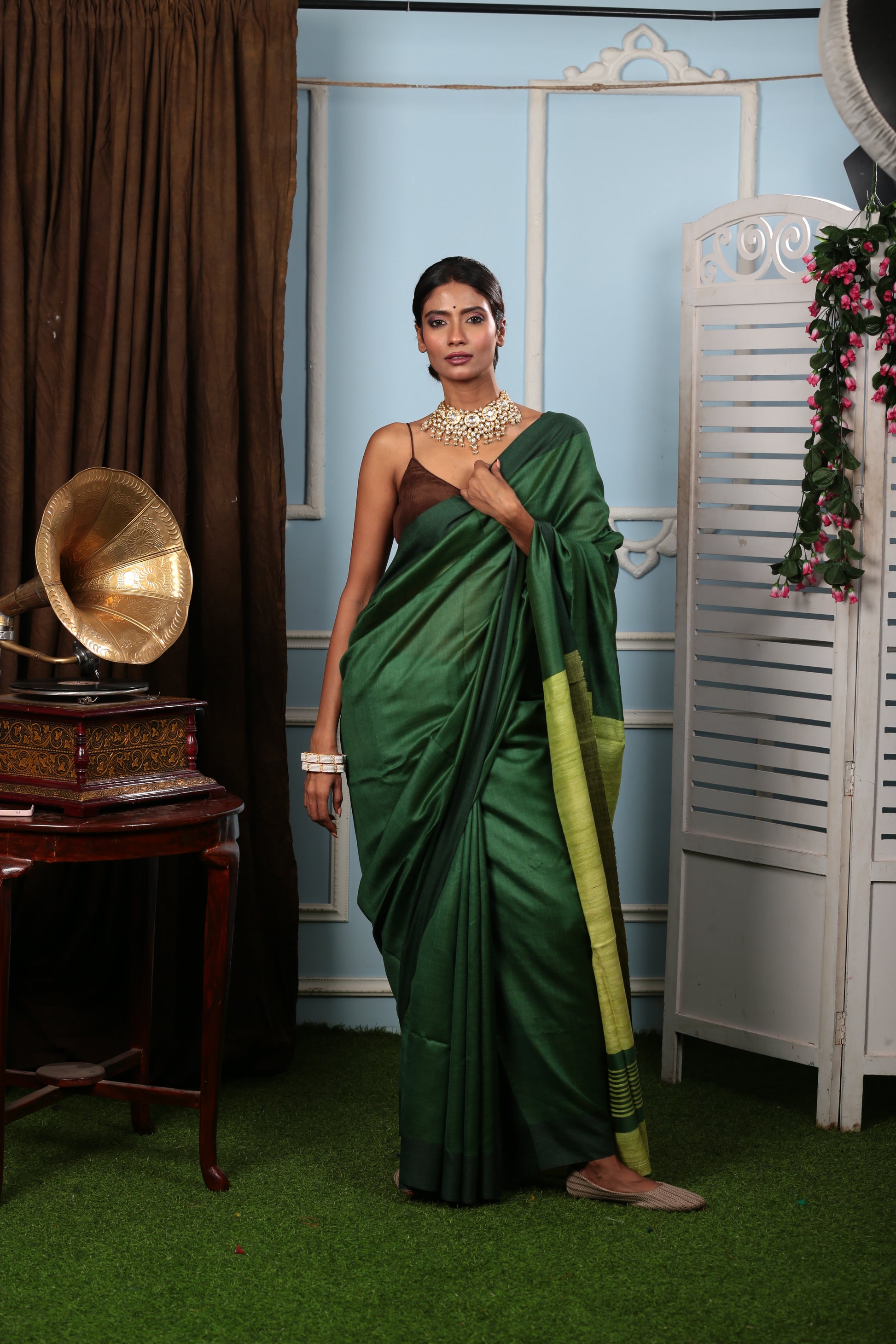 Model in elegant green Tussar saree from Bengal, perfect for brunch or parties. | Urbane Essence
