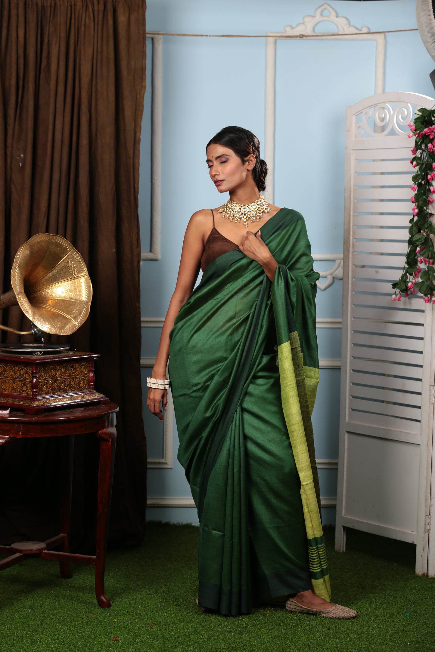 Woman in a handwoven Bengal Tussar saree in shades of green, perfect for brunch or parties | Urbane Essence